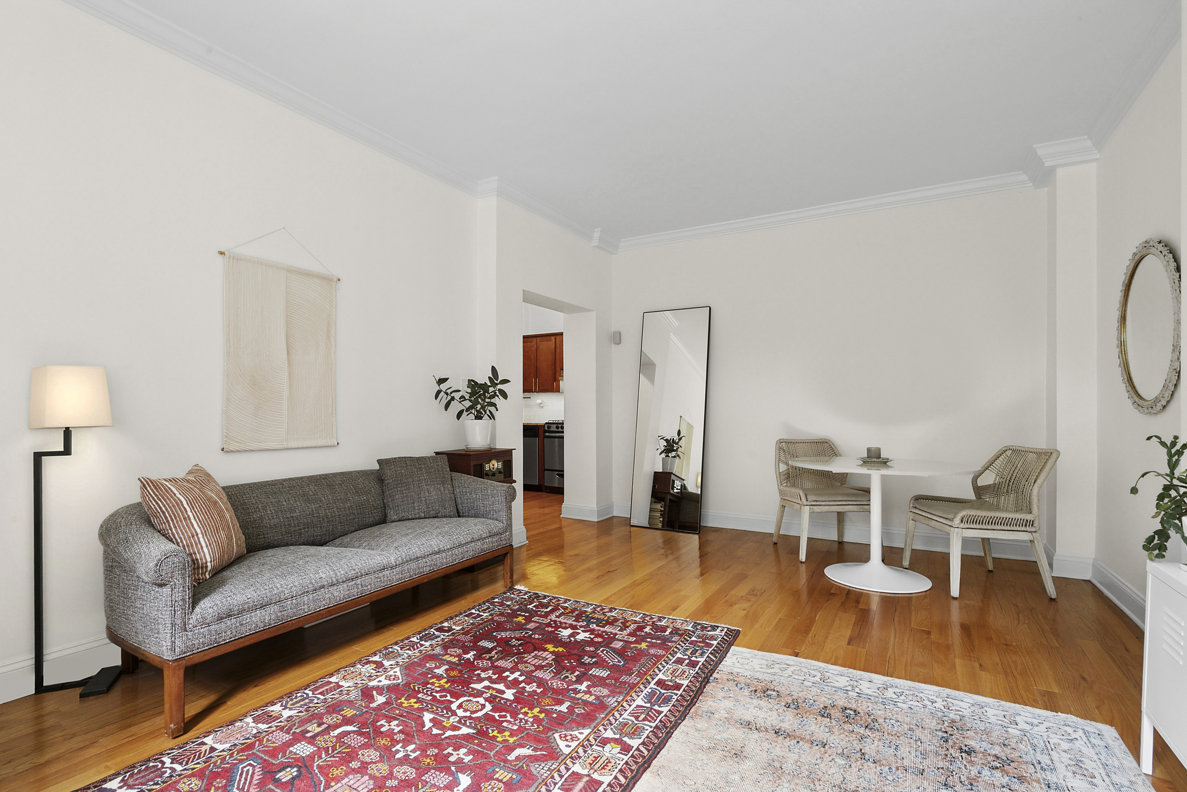 273 Bennett Avenue, Unit 3F Manhattan, NY 10040 - Photo 2 of 9 a living room with furniture a rug and a table