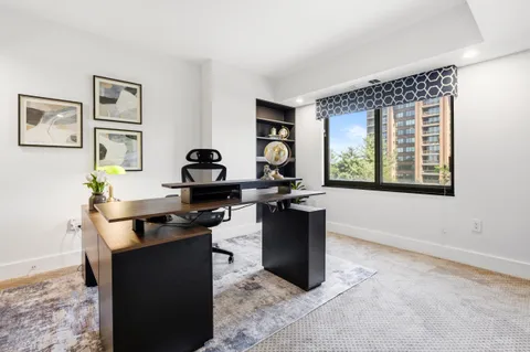 a dining room with furniture and window