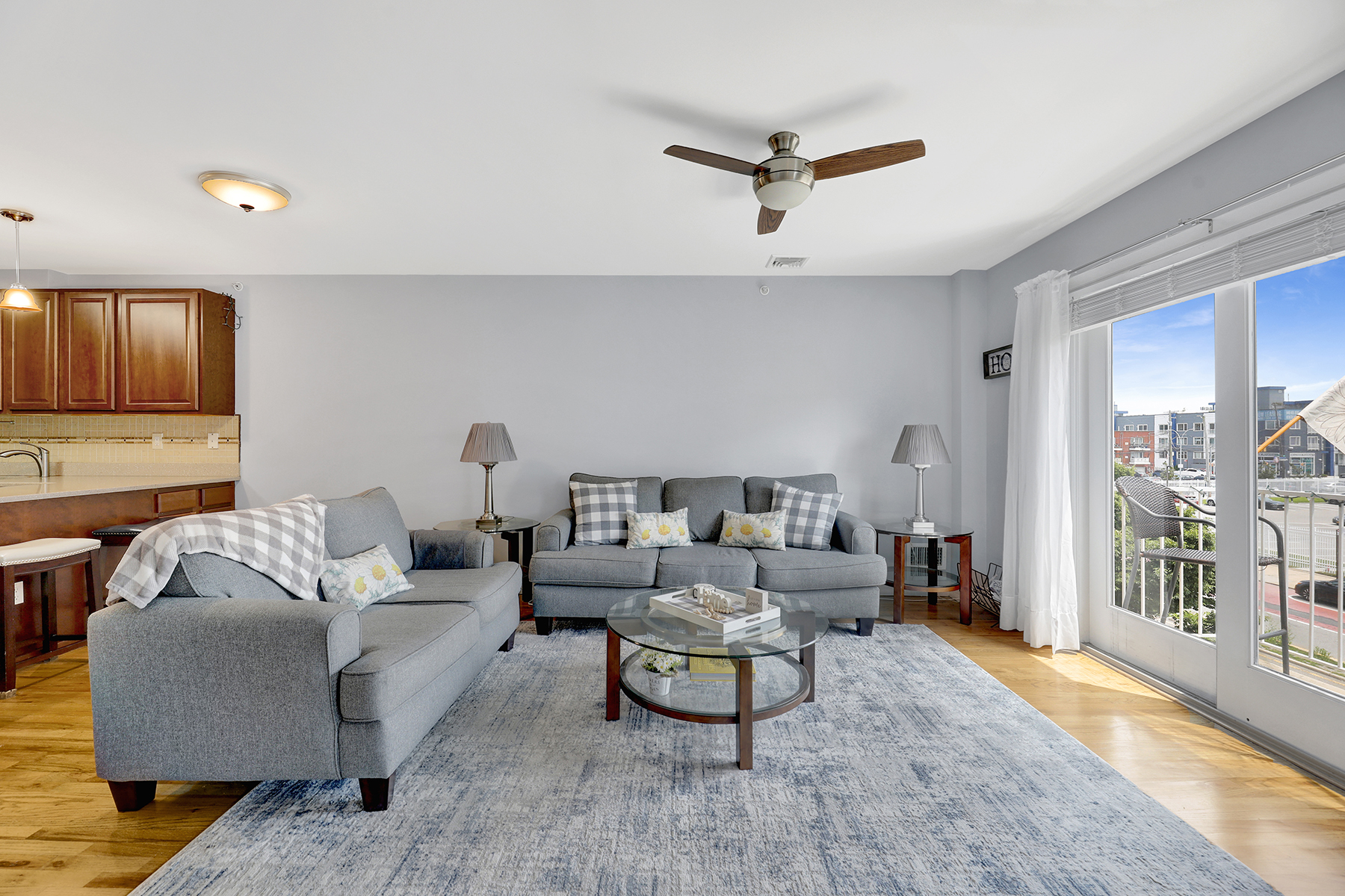 10220 Rockaway Beach Boulevard, Unit 3C Queens, NY 11694 - Photo 5 of 46 a living room with furniture and a wooden floor