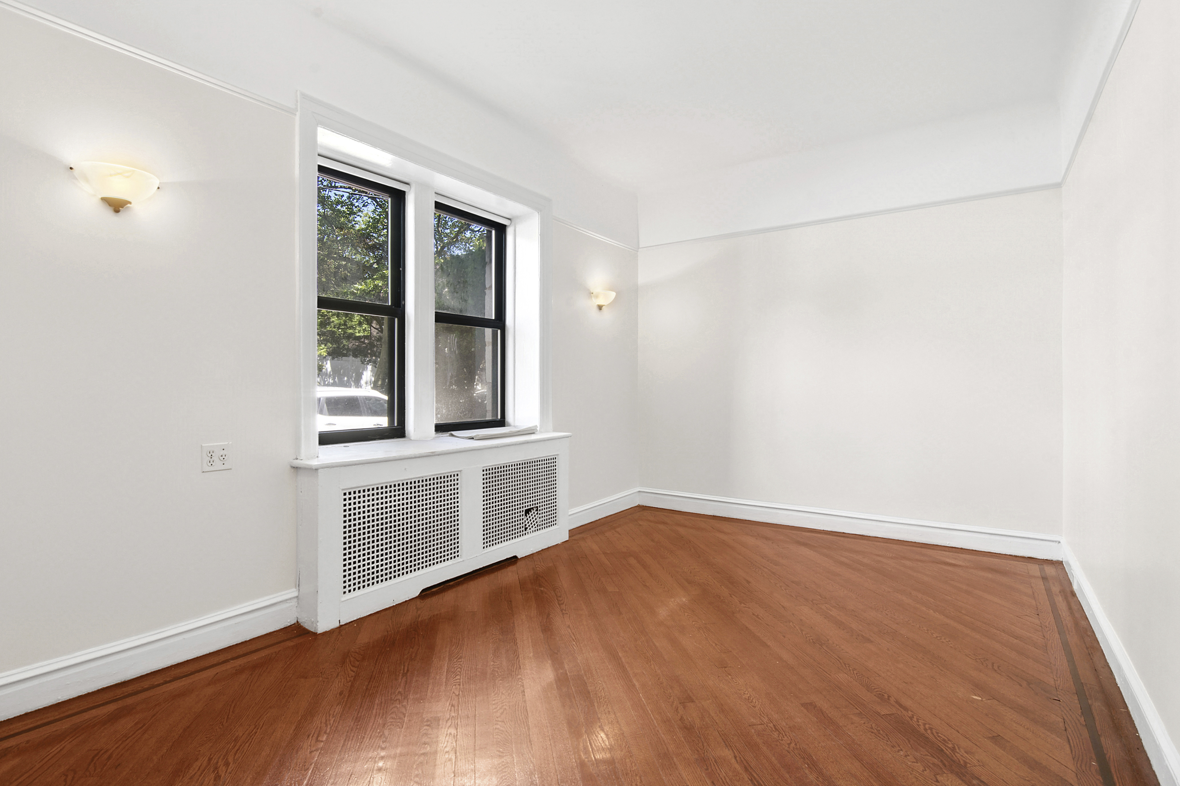 2 Marine Avenue, Unit 1B Brooklyn, NY 11209 - Photo 9 of 14 an empty room with wooden floor and windows