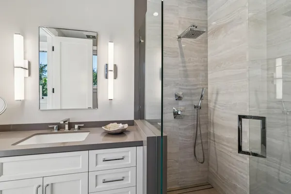 a front view of a house with dining room and wooden fence