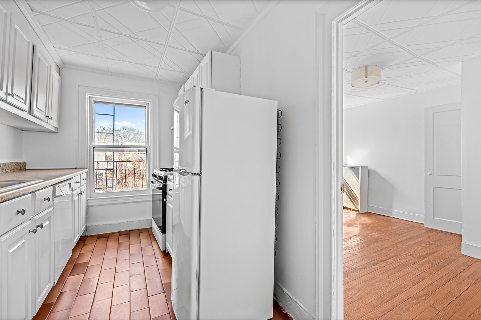 44 Butler Street Brooklyn, NY 11231 - Photo 16 of 22 a kitchen with a refrigerator and white cabinets