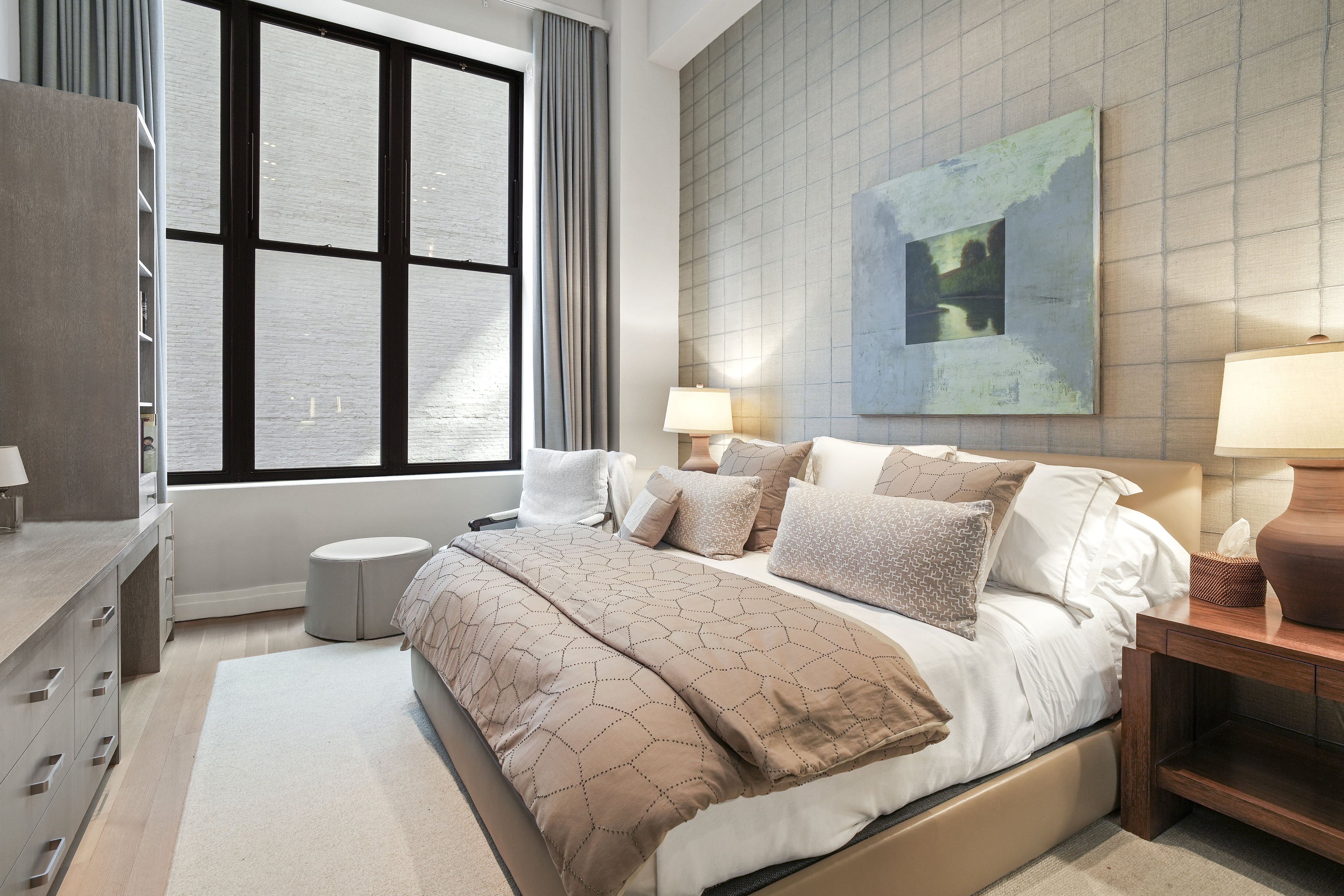 421 Hudson Street, Unit 221 Manhattan, NY 10014 - Photo 5 of 12 a bedroom with a large bed and a window
