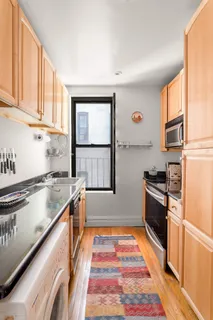 a kitchen with stainless steel appliances granite countertop a stove and a sink