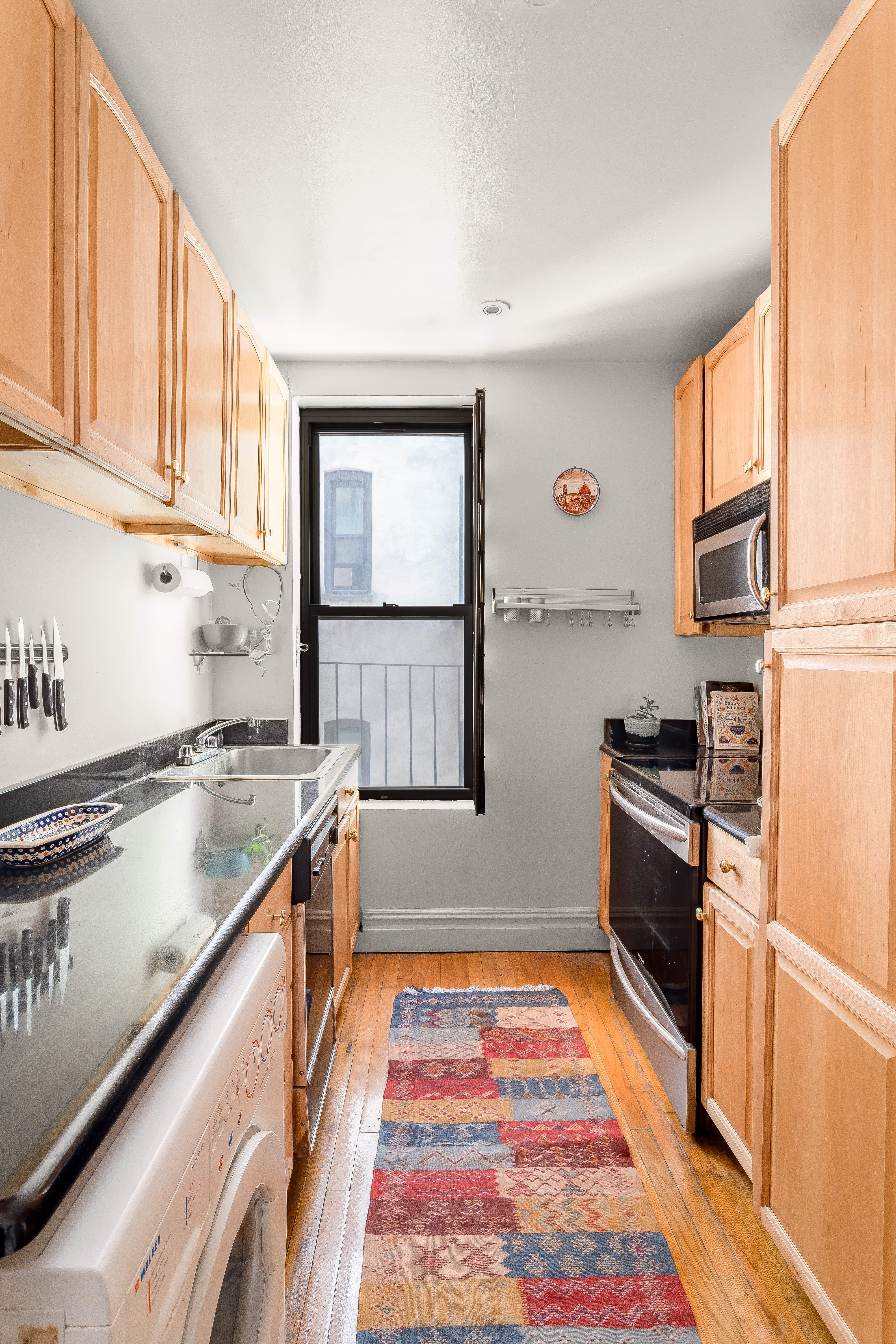 501 West 122nd Street, Unit A2 Manhattan, NY 10027 - Photo 5 of 21 a kitchen with stainless steel appliances granite countertop a stove and a sink