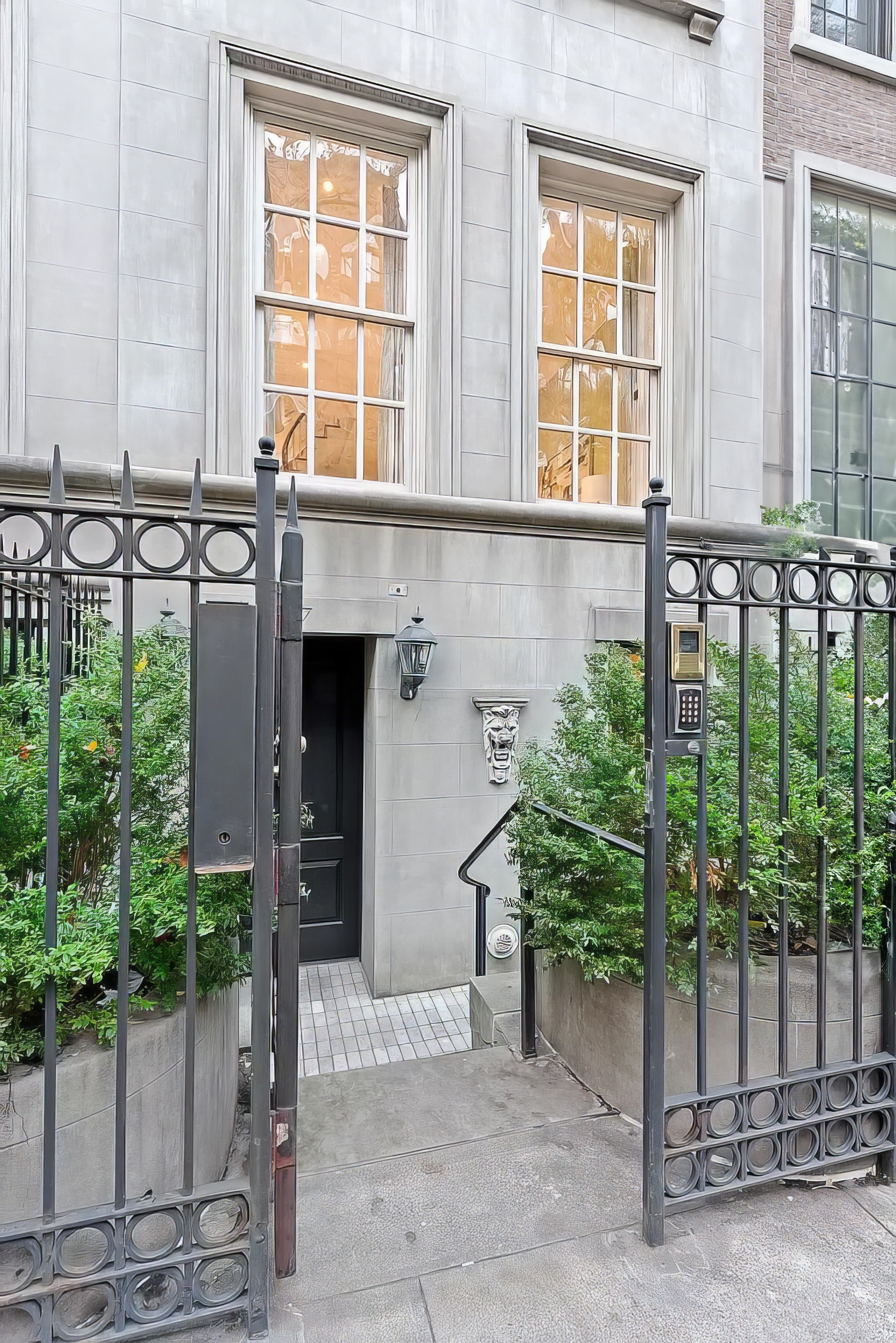 247 East 71st Street Manhattan, NY 10021 - Photo 30 of 31 a front view of a house with plants