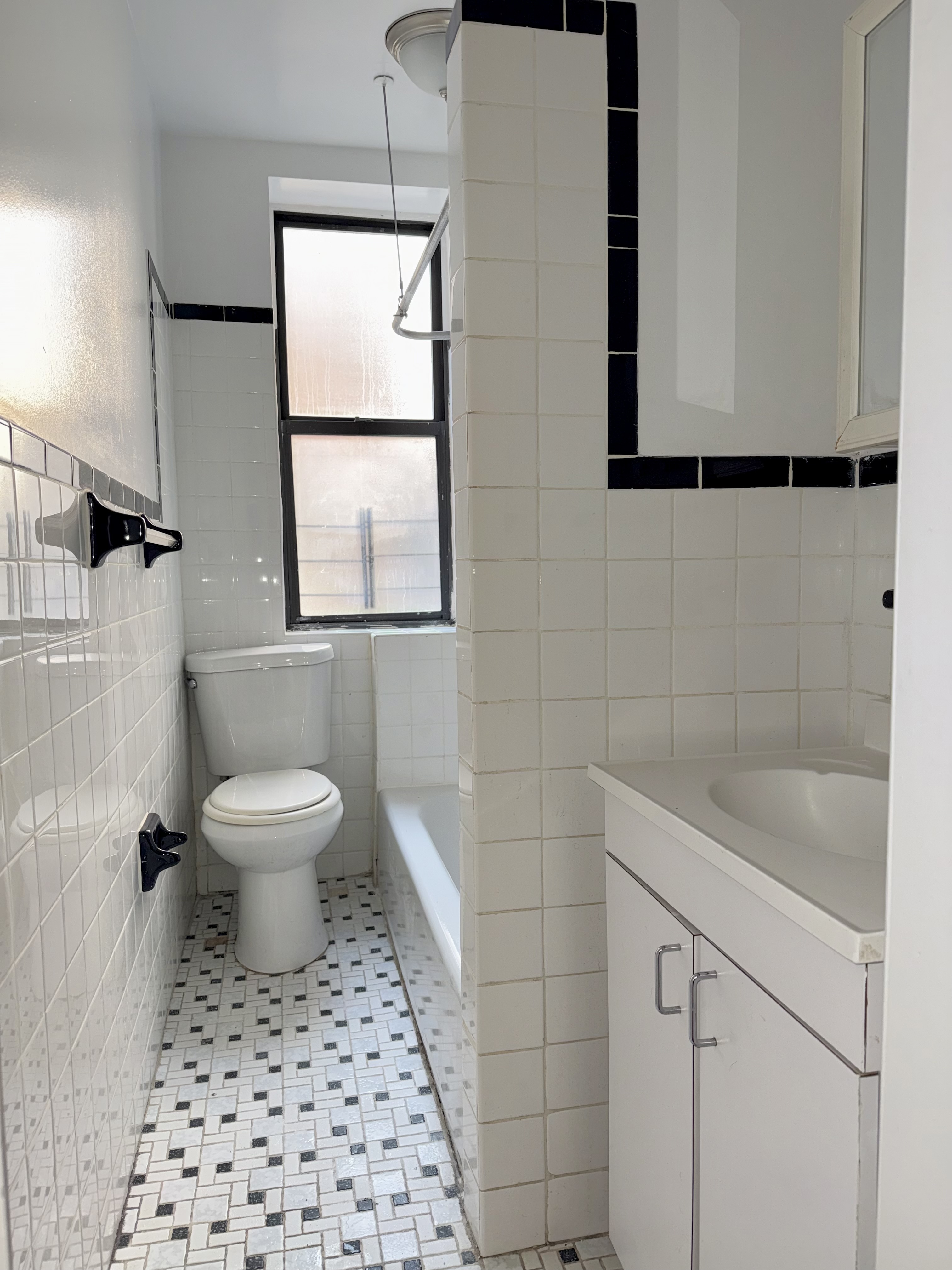 153 Vermilyea Avenue, Unit 4B Manhattan, NY 10034 - Photo 8 of 9 a bathroom with a toilet a window and a shower