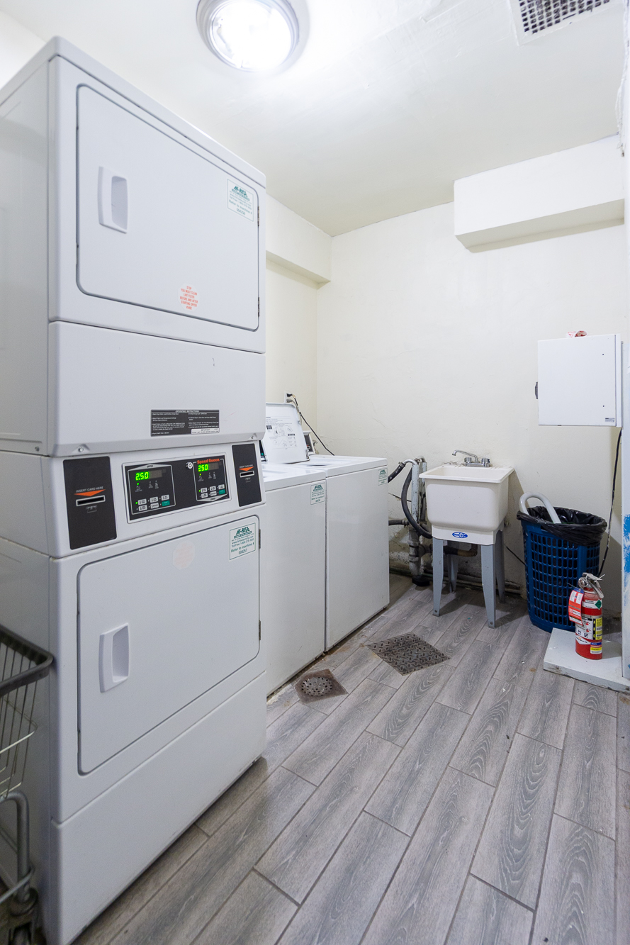 227 East 5th Street, Unit BE Manhattan, NY 10003 - Photo 5 of 7 a utility room with dryer and washer
