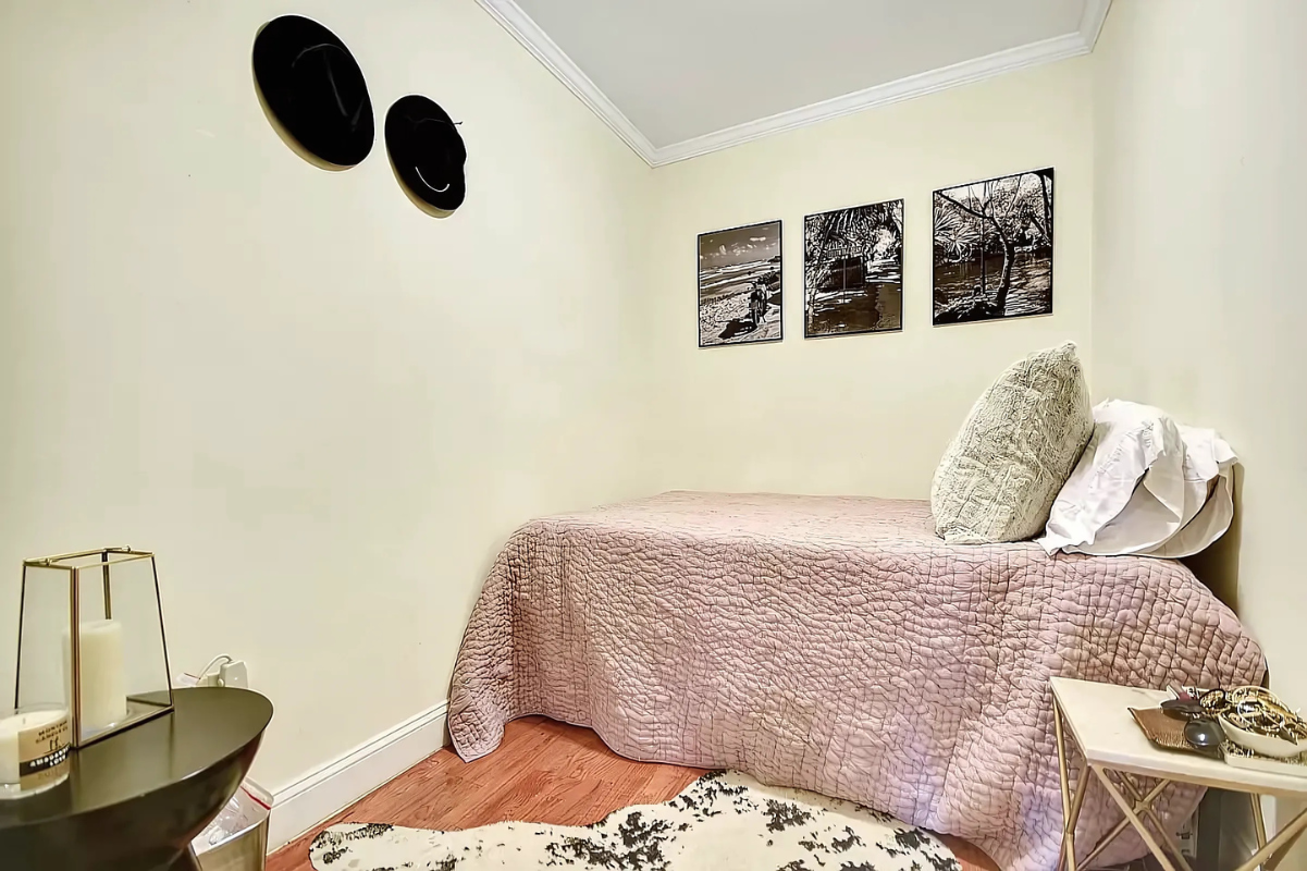 1273 1st Avenue, Unit 8 Manhattan, NY 10065 - Photo 3 of 6 a bedroom with a bed and cabinets