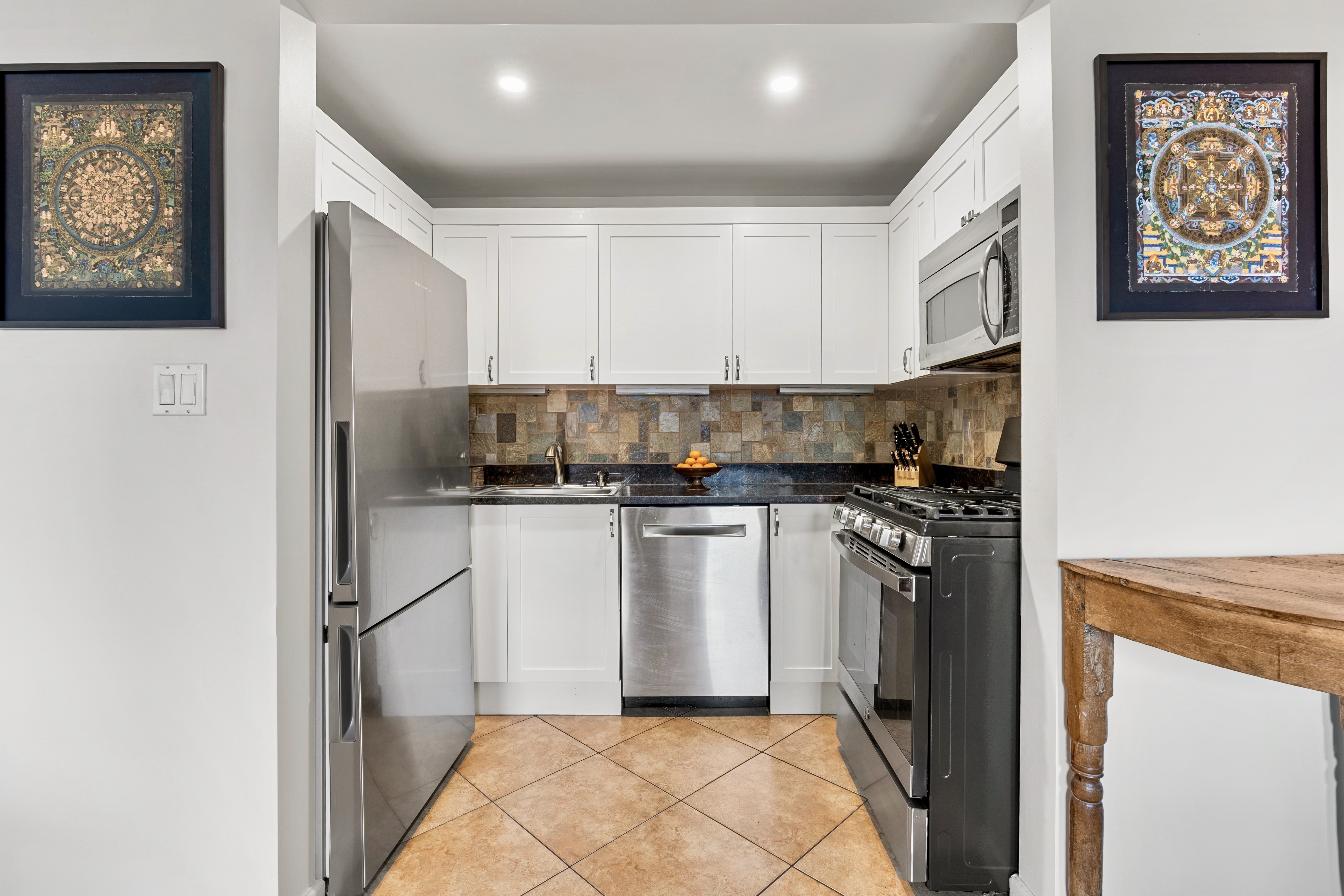394 12th Street, Unit 5 Brooklyn, NY 11215 - Photo 6 of 14 a kitchen with stainless steel appliances granite countertop a refrigerator and a stove