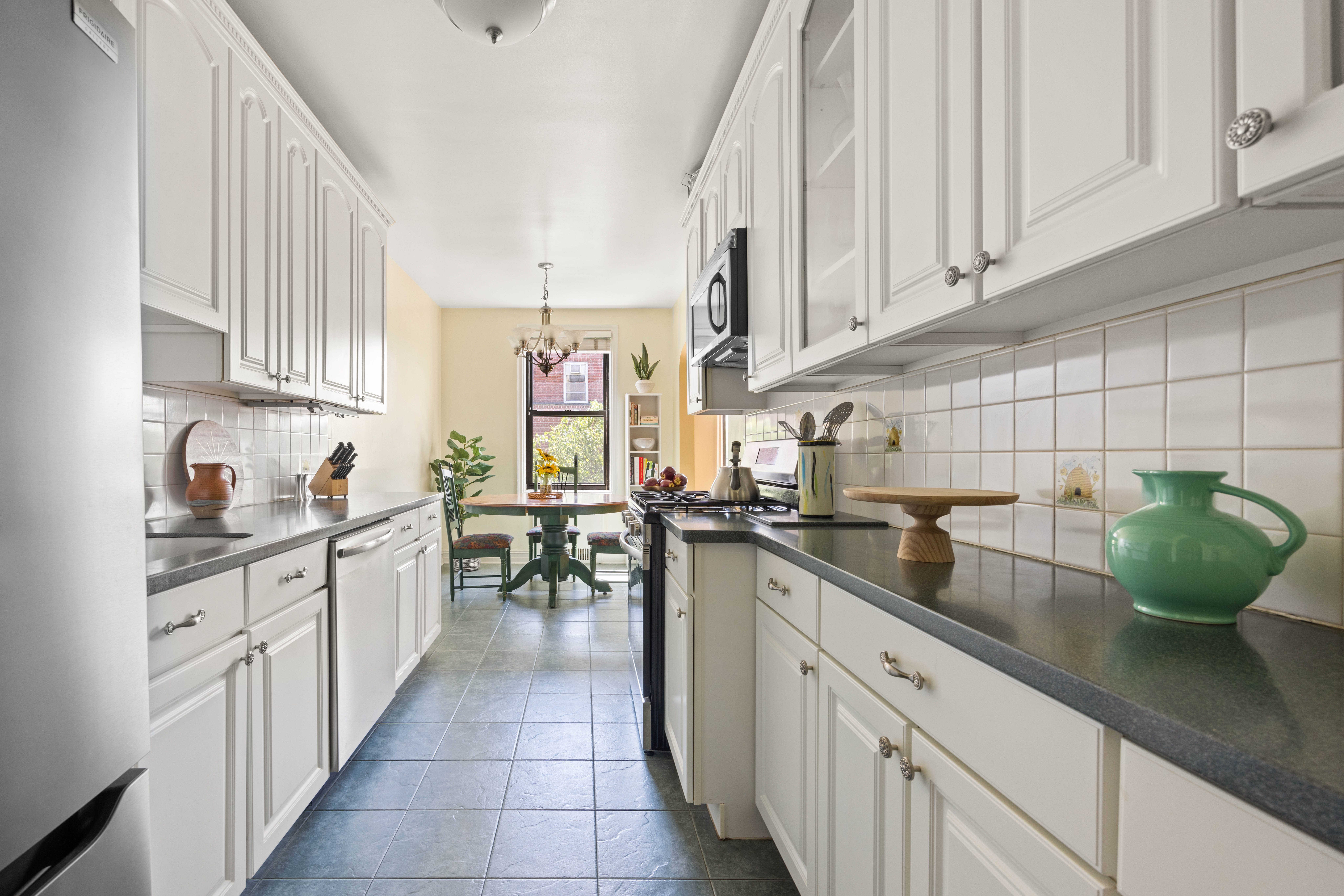 30 Ocean Parkway, Unit 5H Brooklyn, NY 11218 - Photo 5 of 17 a kitchen with a sink dishwasher white cabinets and a sink