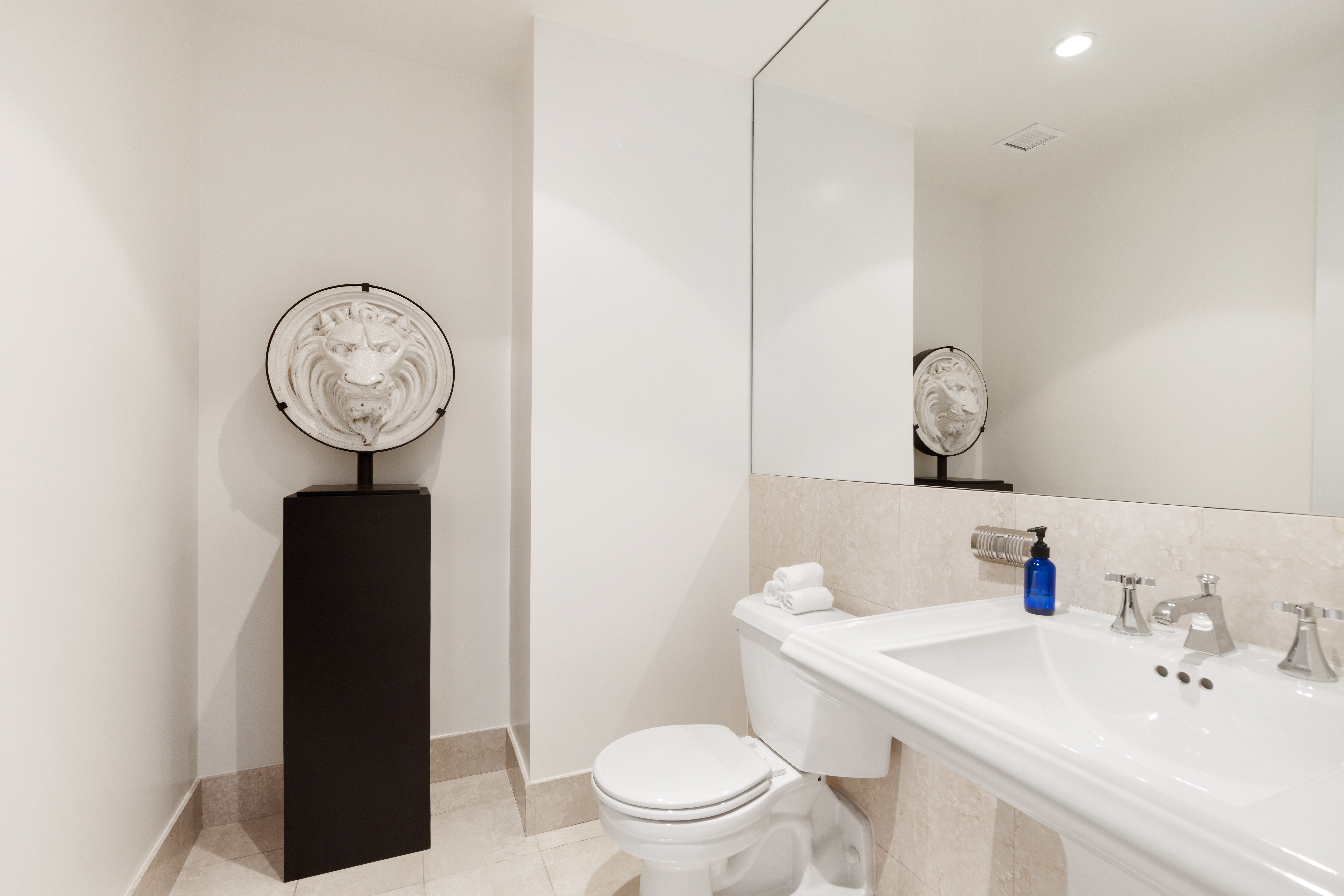 250 East 30th Street, Unit 14B Manhattan, NY 10016 - Photo 12 of 14 a bathroom with a sink a toilet and a mirror