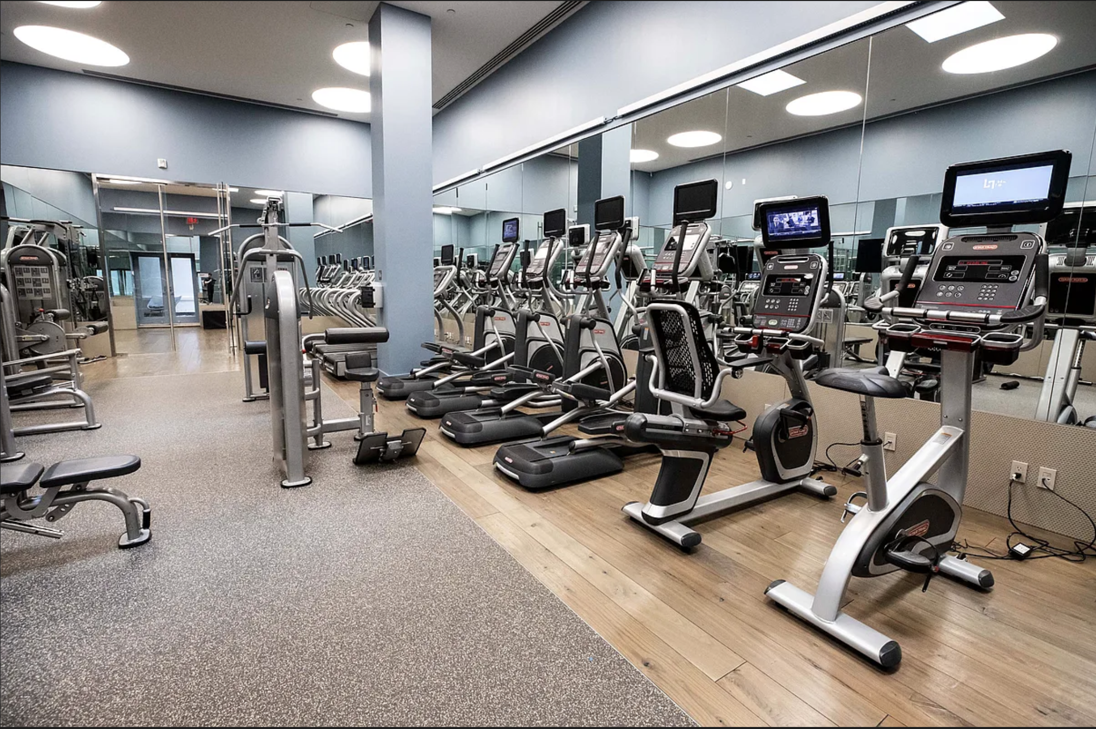 25 Broad Street, Unit 11K Manhattan, NY 10004 - Photo 8 of 16 a view of a room with gym equipment