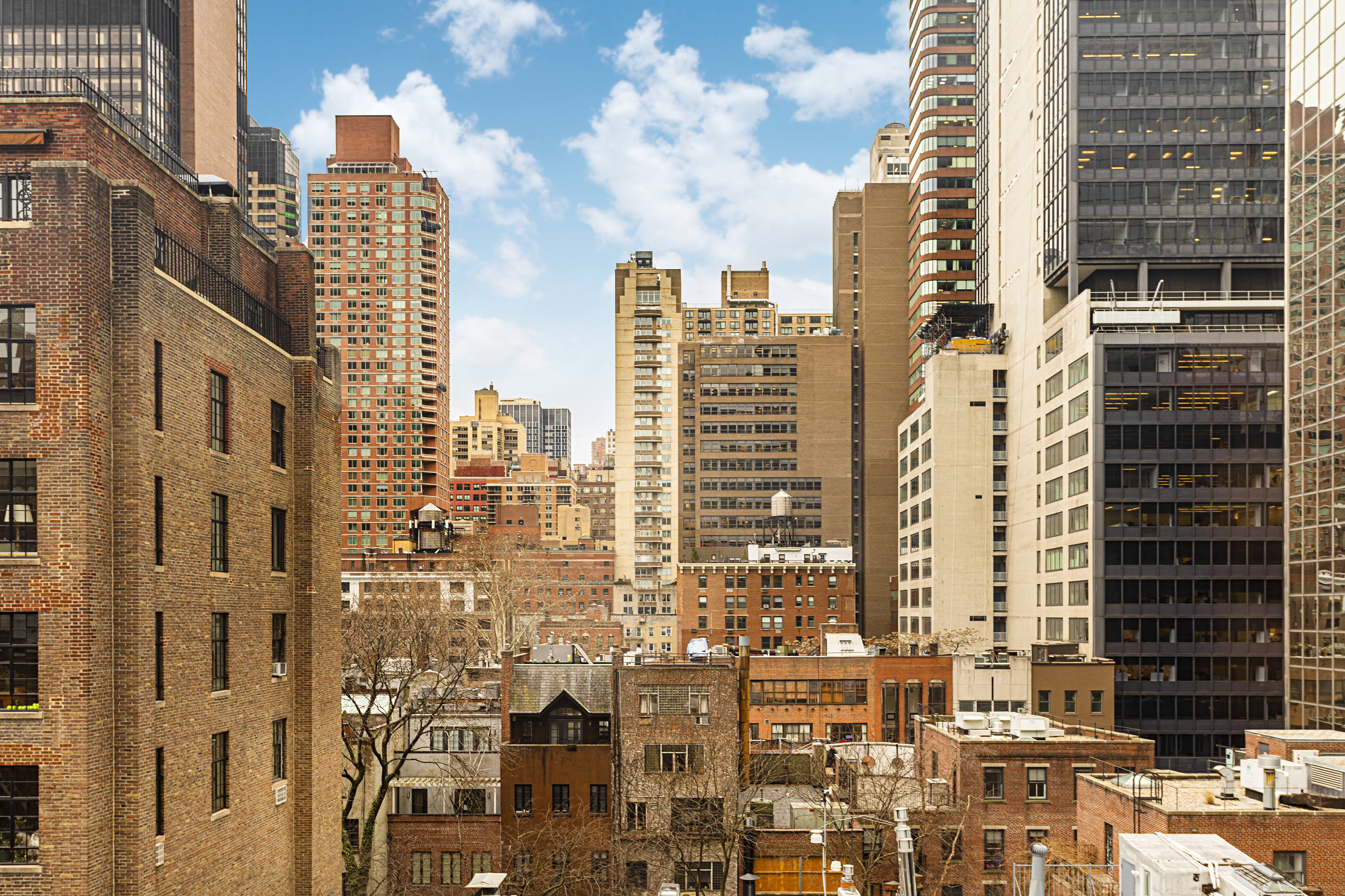221 East 50th Street, Unit 8A Manhattan, NY 10022 - Photo 7 of 8 a city view with tall buildings