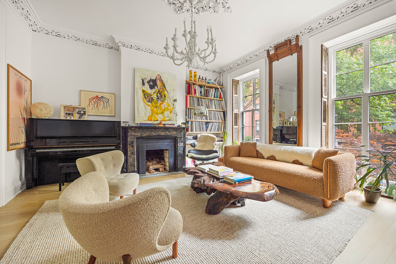 298 State Street Brooklyn, NY 11201 - Photo 2 of 21 a living room with furniture a fireplace and a chandelier