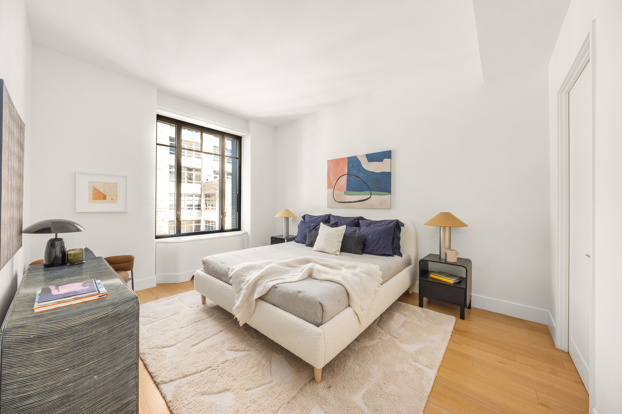 110 Charlton Street, Unit 17E Manhattan, NY 10014 - Photo 13 of 20 a bedroom with a bed and a couch