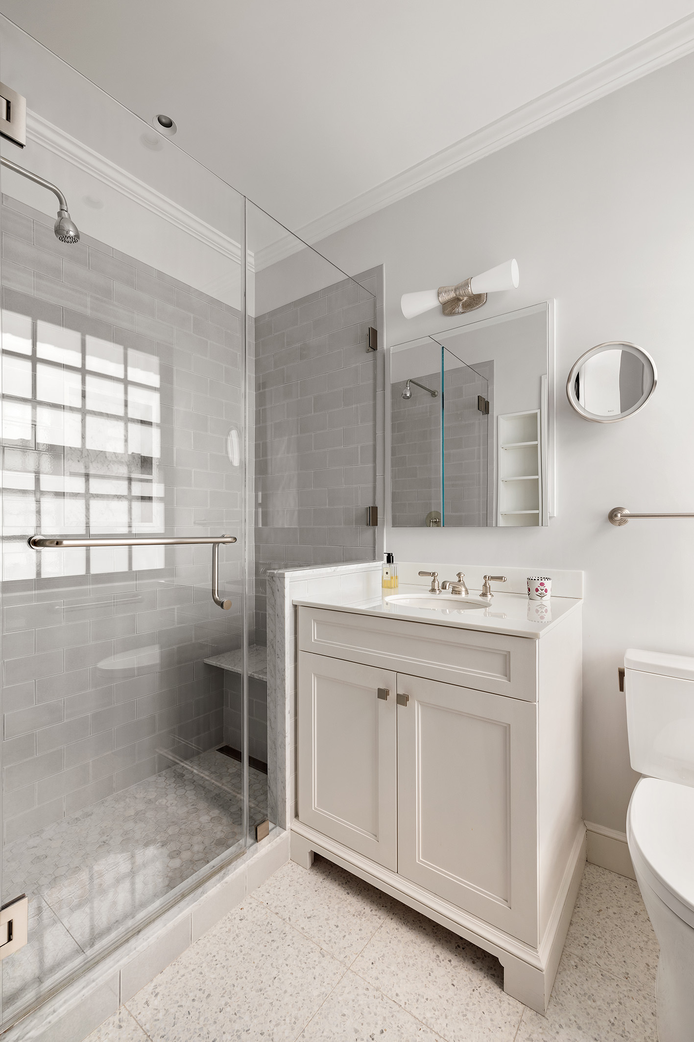 129 East 69th Street, Unit 8/9A Manhattan, NY 10021 - Photo 8 of 16 a bathroom with a sink toilet and shower