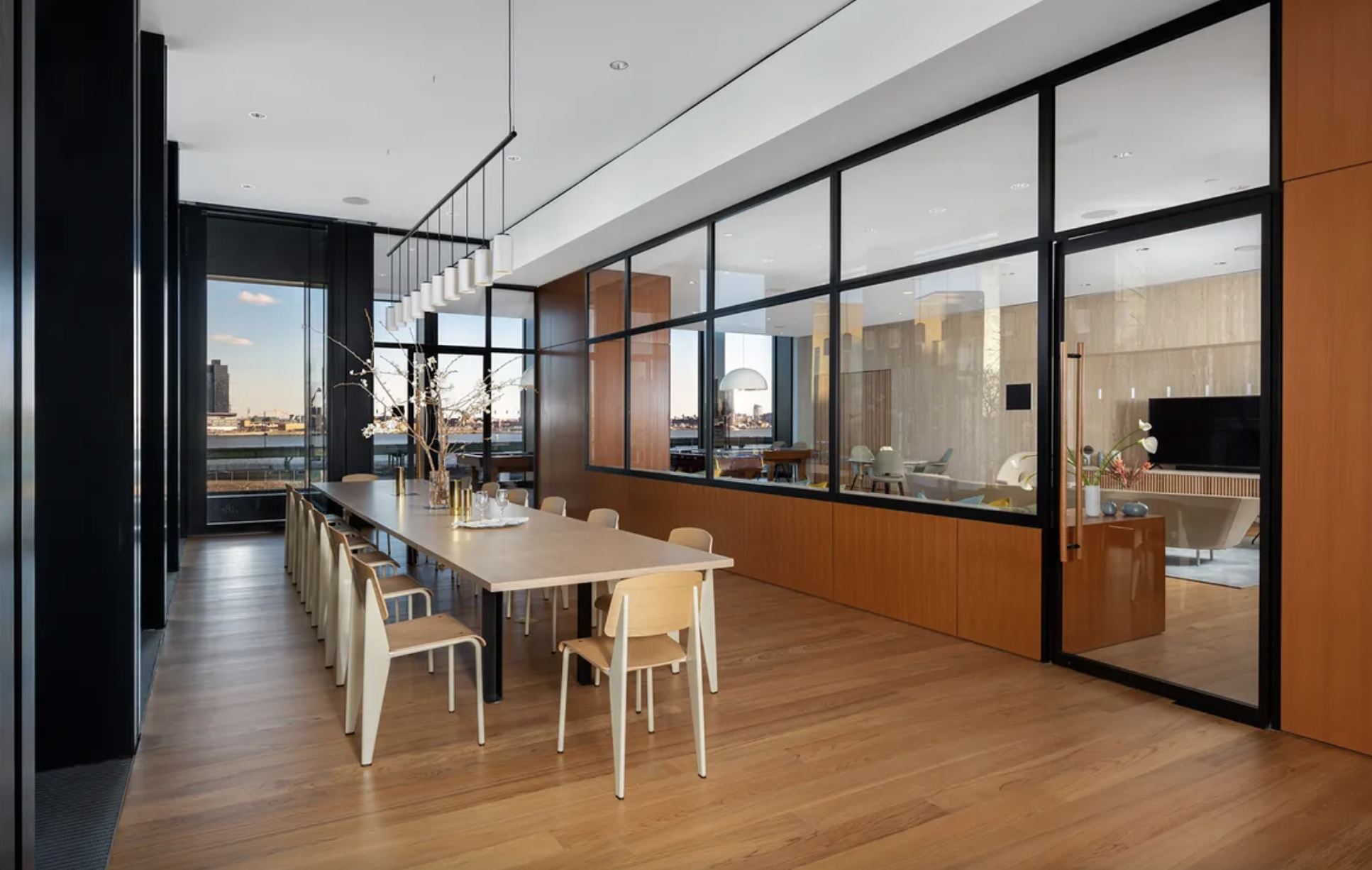 695 1st Avenue, Unit 31C Manhattan, NY 10016 - Photo 23 of 27 a dining room with stainless steel appliances granite countertop a stove kitchen island a refrigerator and a view of living room