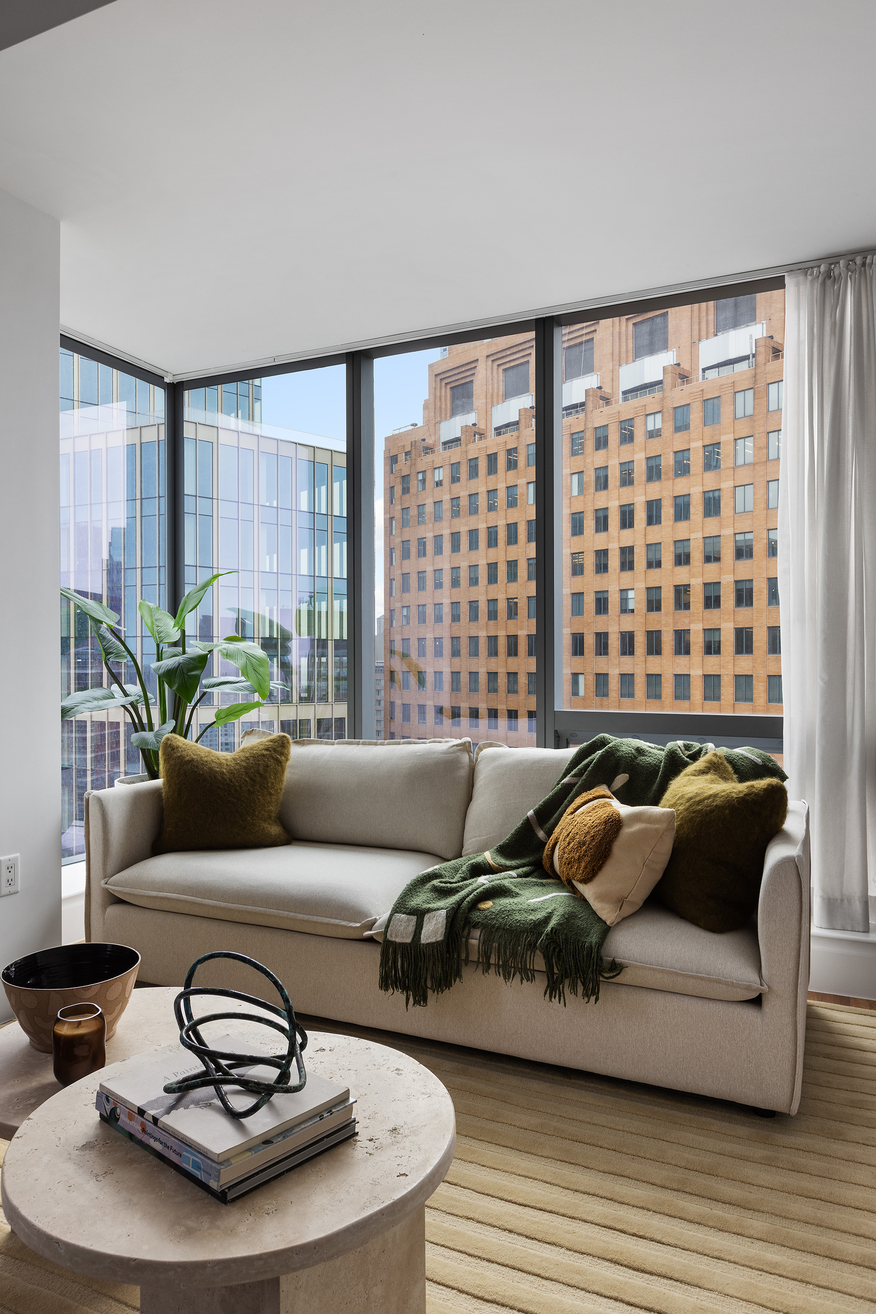 150 Myrtle Avenue, Unit 2506 Brooklyn, NY 11201 - Photo 7 of 16 a living room with furniture and a floor to ceiling window