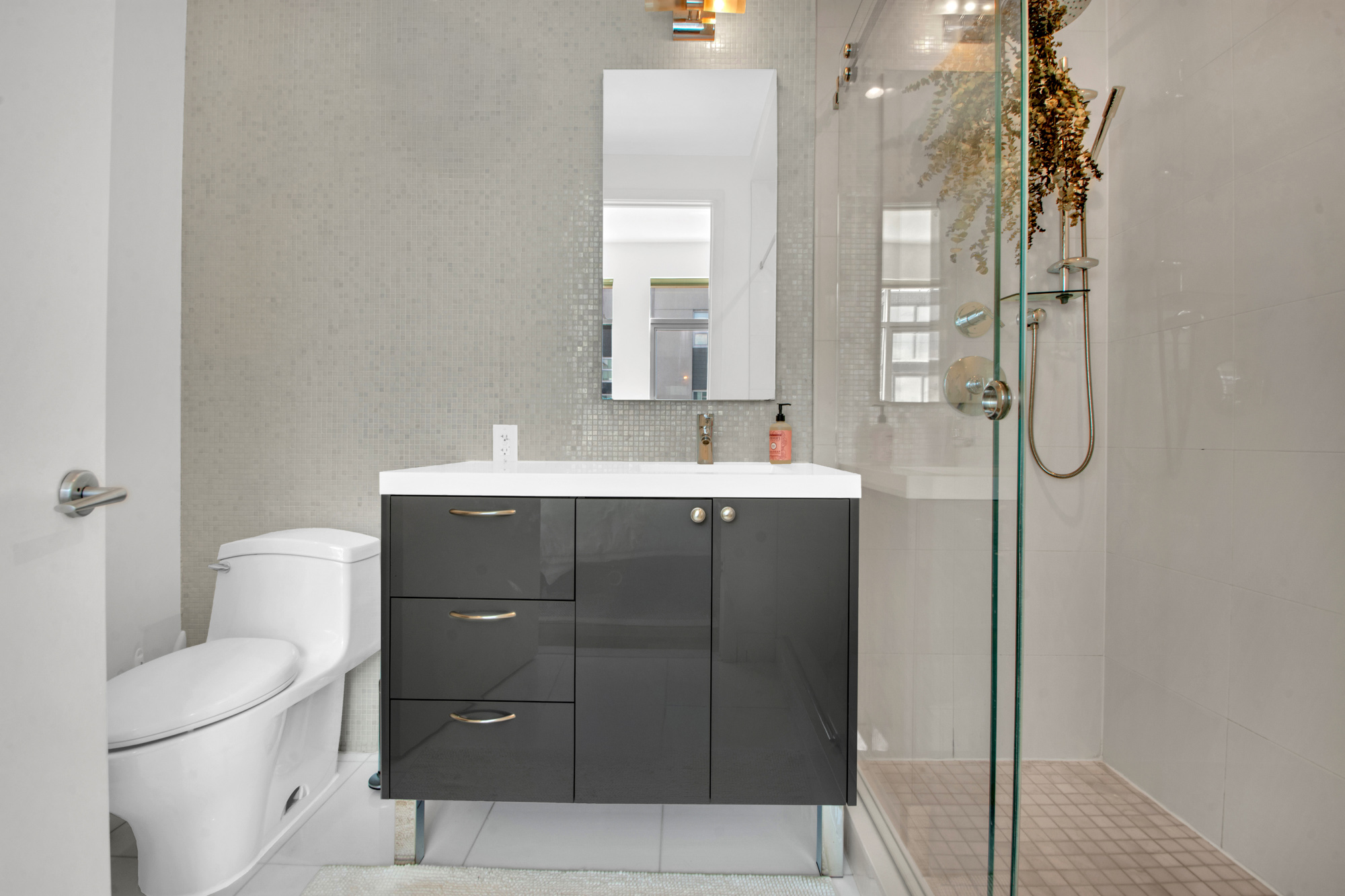 101 North 5th Street, Unit 5A Brooklyn, NY 11249 - Photo 16 of 26 a bathroom with a sink vanity mirror and toilet