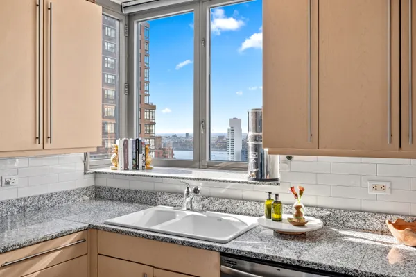 a kitchen with a sink and a window