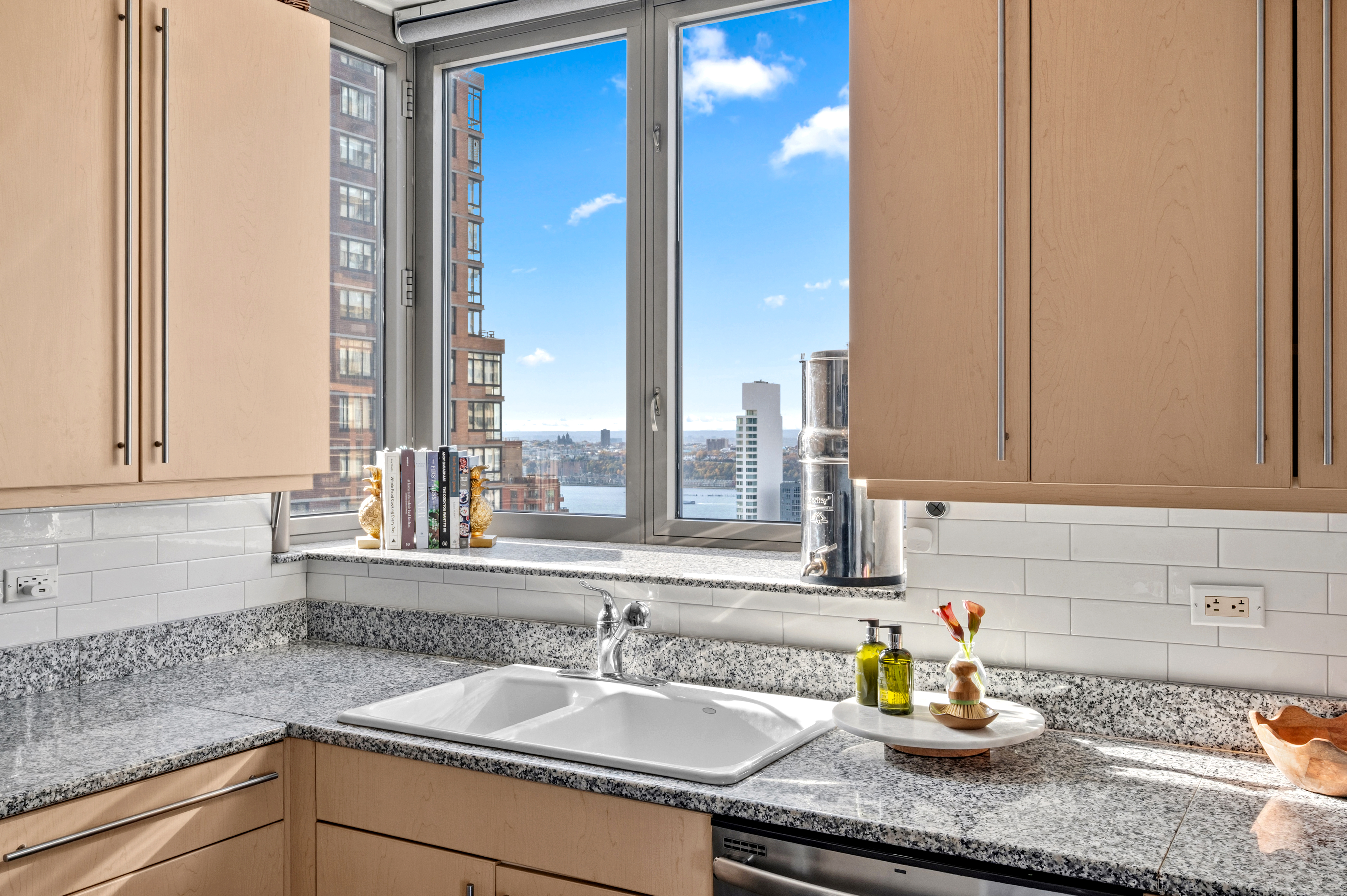 2 Columbus Avenue, Unit 32A Manhattan, NY 10023 - Photo 5 of 12 a kitchen with a sink and a window
