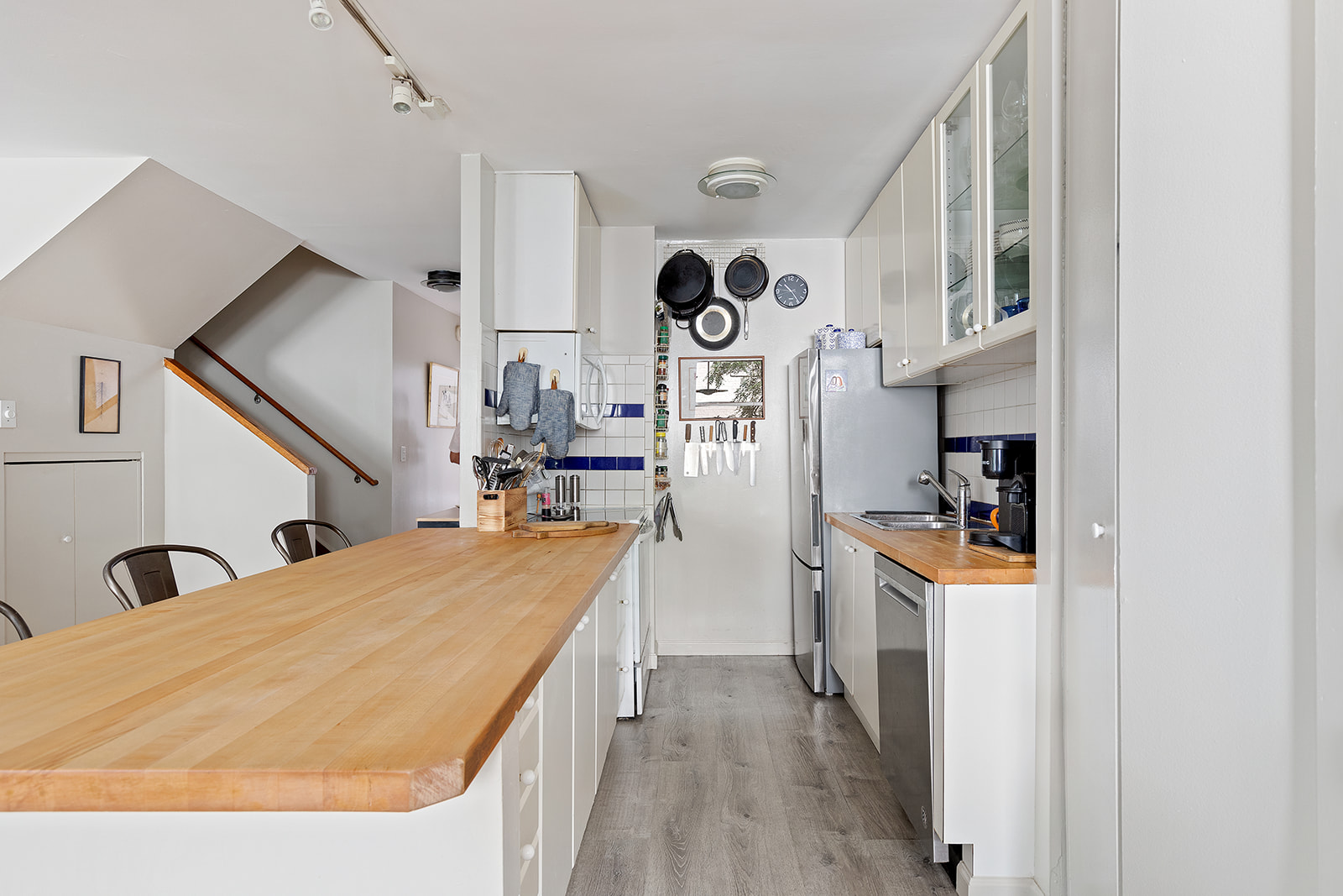 153 Perry Street, Unit 4B Manhattan, NY 10014 - Photo 2 of 10 a room with cabinets and wooden floor