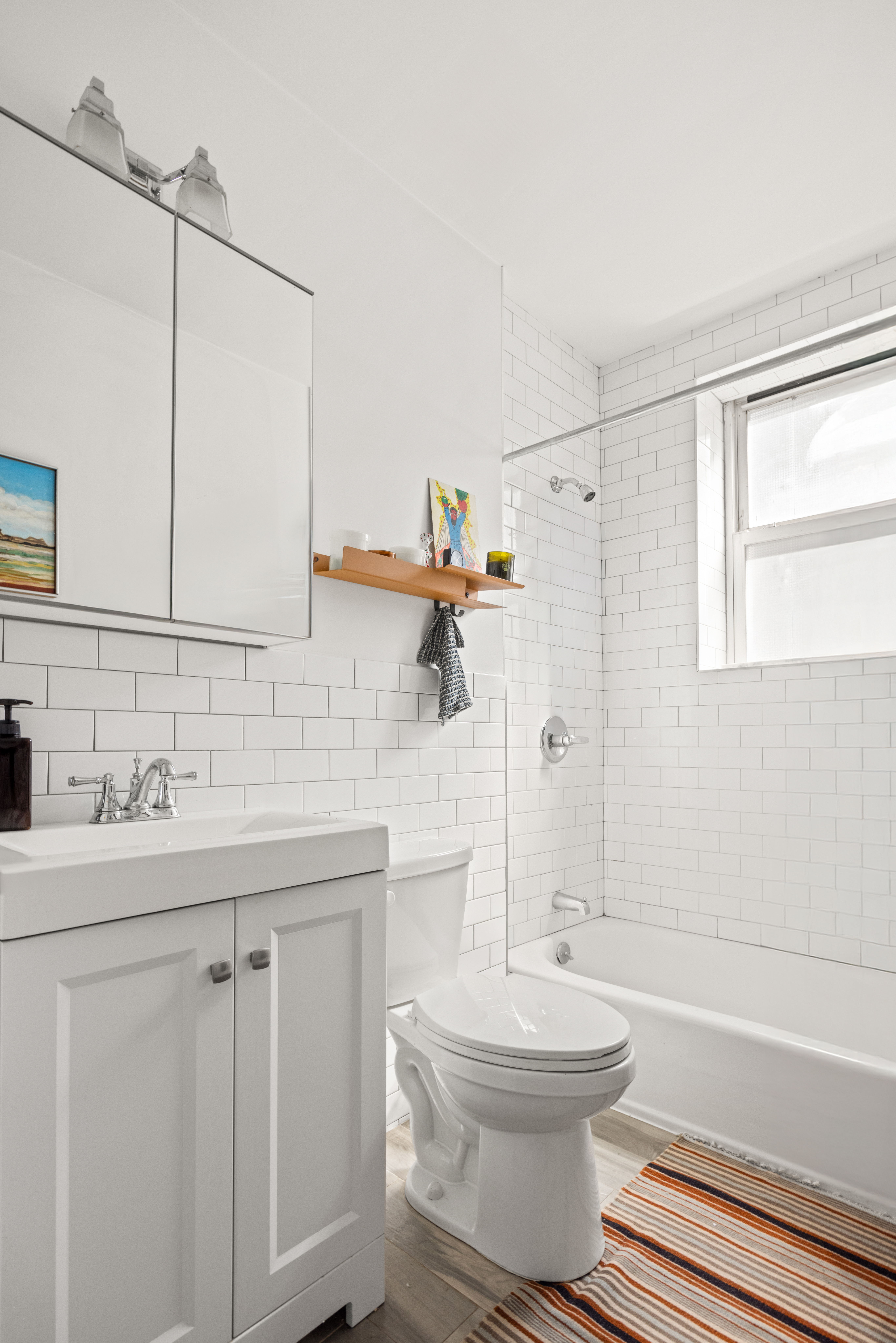 192-194 Union Street Brooklyn, NY 11231 - Photo 27 of 37 a bathroom with a toilet sink a mirror and shower