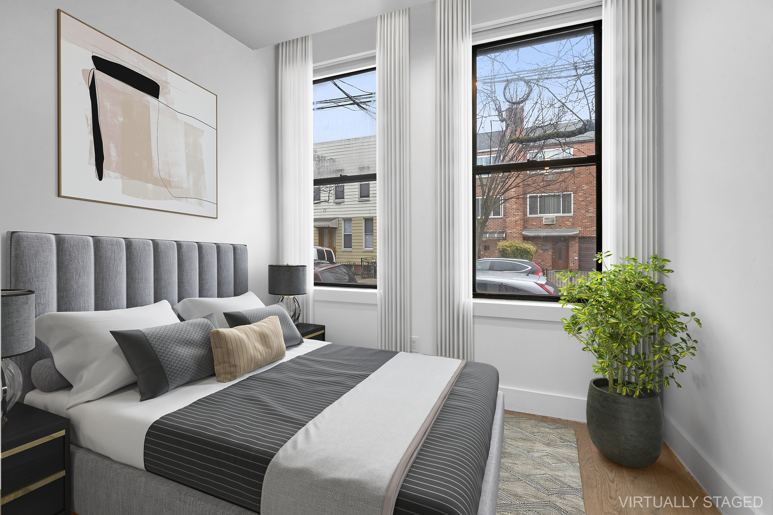 20-27 Menahan Street, Unit 1R Queens, NY 11385 - Photo 6 of 12 a bed room with a bed and a potted plant