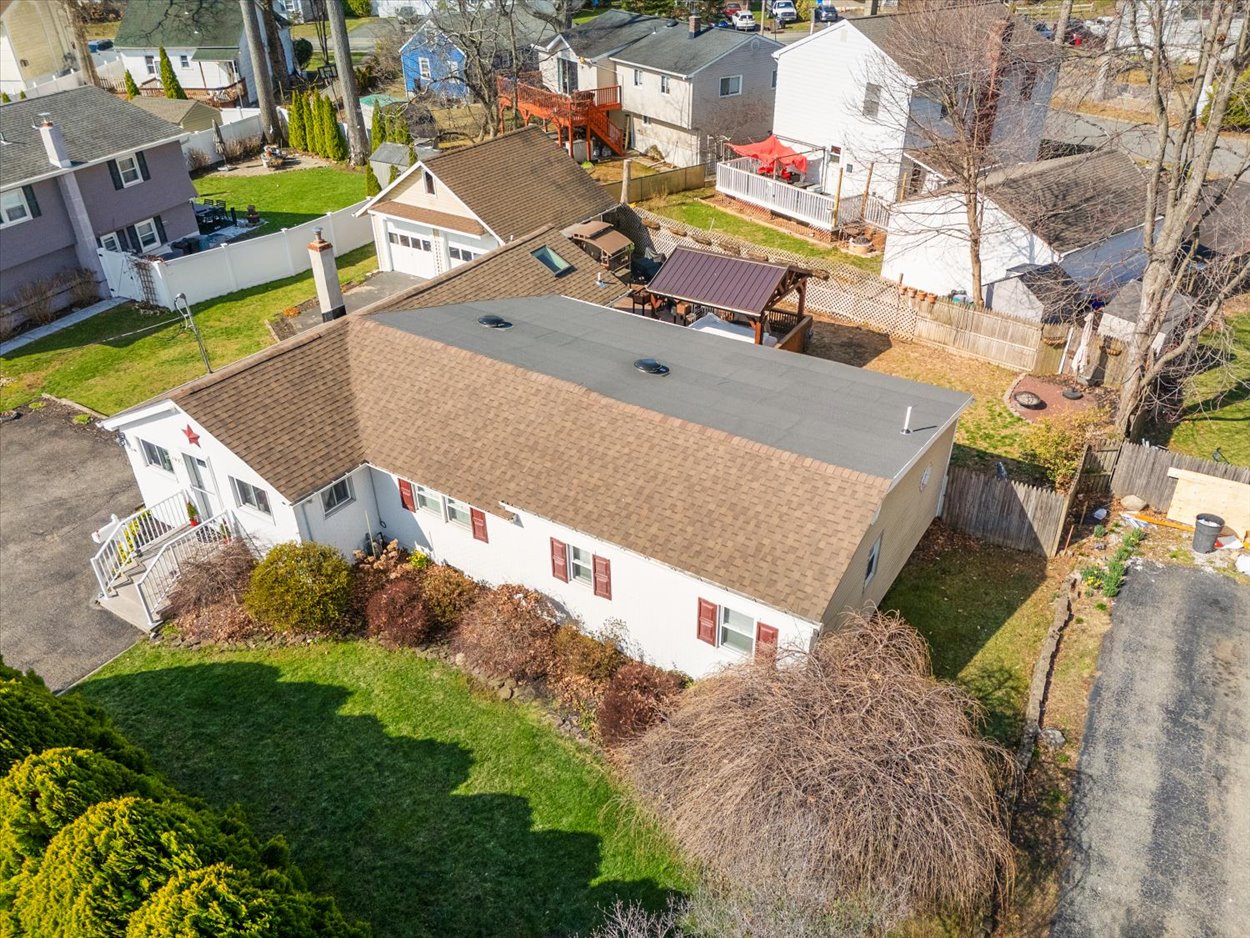 107 Kingston Road Parsippany, NJ 07054 - Photo 35 of 43 an aerial view of a house with a garden and swimming pool