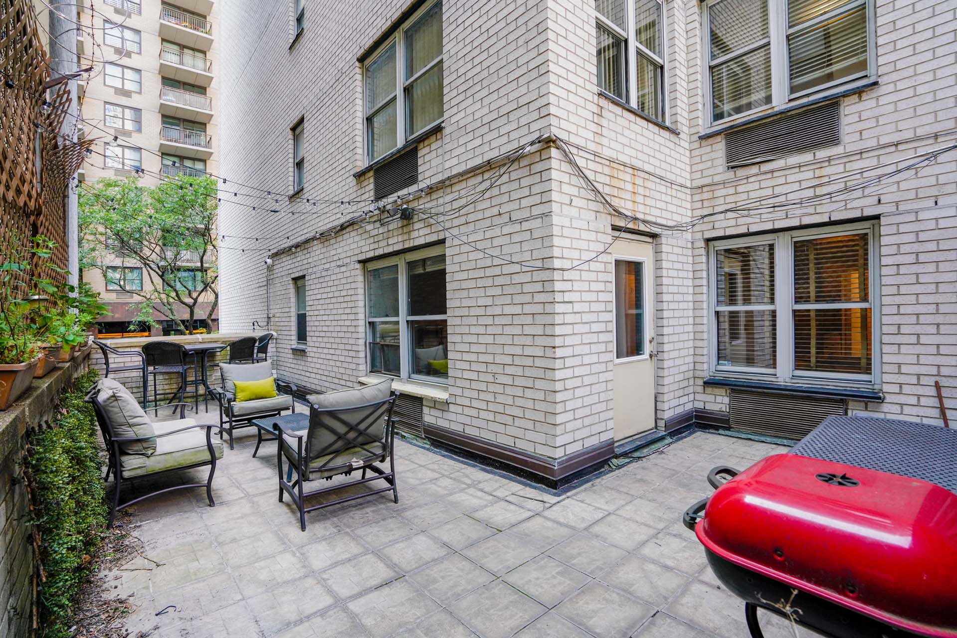 301 East 75th Street, Unit 2G Manhattan, NY 10021 - Photo 4 of 14 a building outdoor space with patio furniture