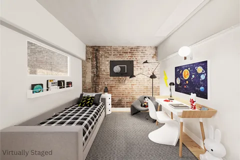 a bedroom with furniture and a fireplace