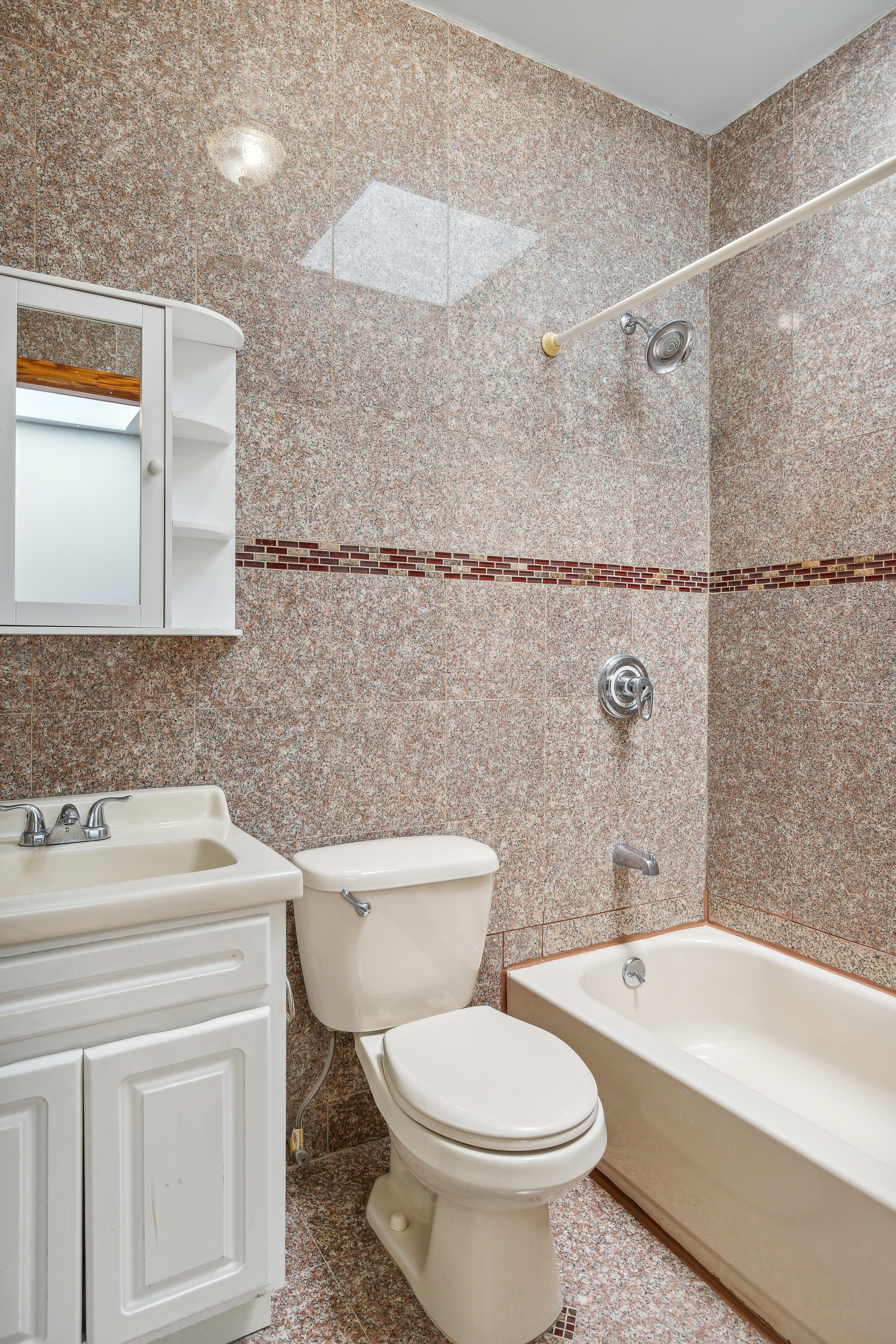 530 West 175th Street, Unit 2 Manhattan, NY 10033 - Photo 10 of 12 a bathroom with a sink toilet and shower