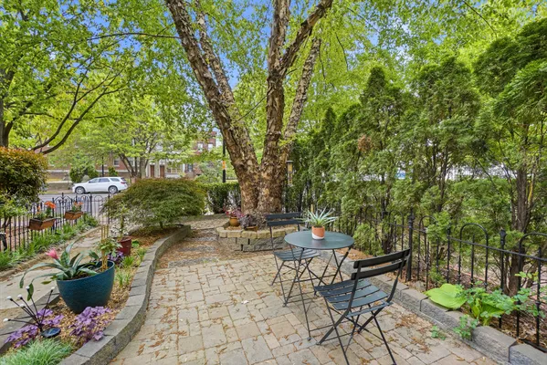 a view of a lounge chairs in a backyard