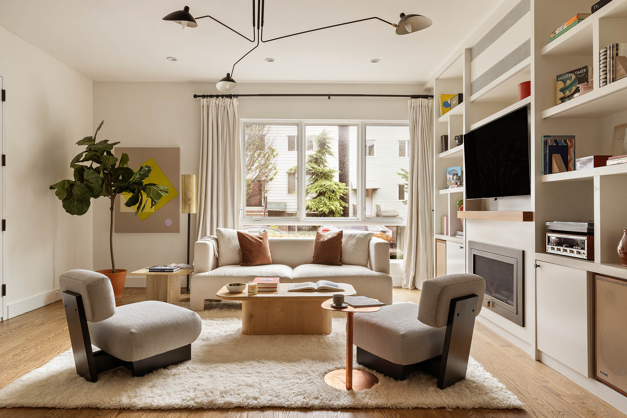 1025 Lorimer Street, Unit PARLOR Brooklyn, NY 11222 - Photo 2 of 21 a living room with furniture a flat screen tv and a floor to ceiling window