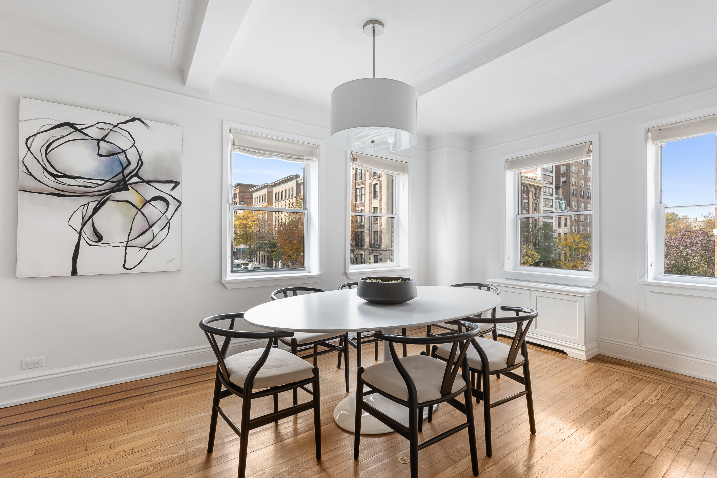 49 East 96th Street, Unit 4D Manhattan, NY 10128 - Photo 3 of 18 a dining room with furniture and window