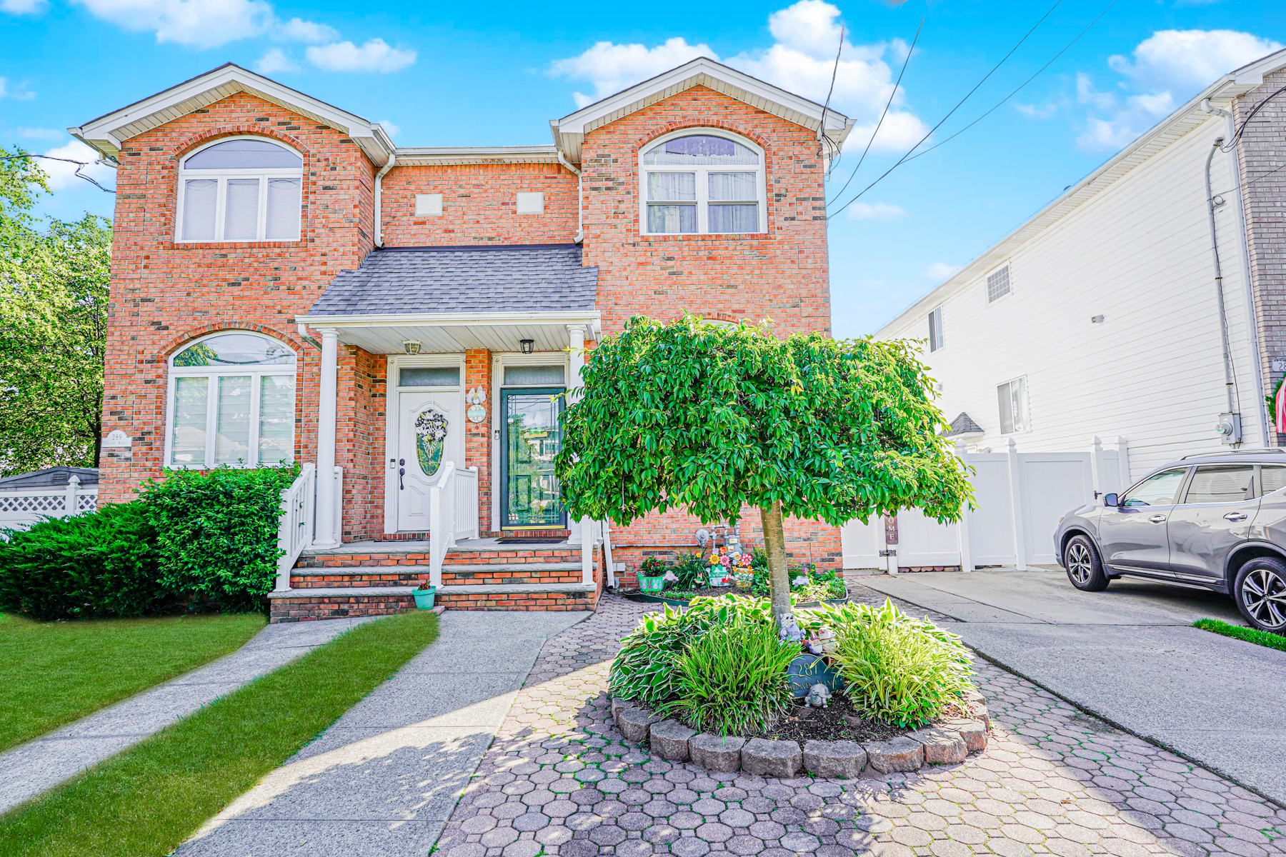 287 Greaves Avenue Staten Island, NY 10308 - Photo 1 of 35 a front view of a house with a yard