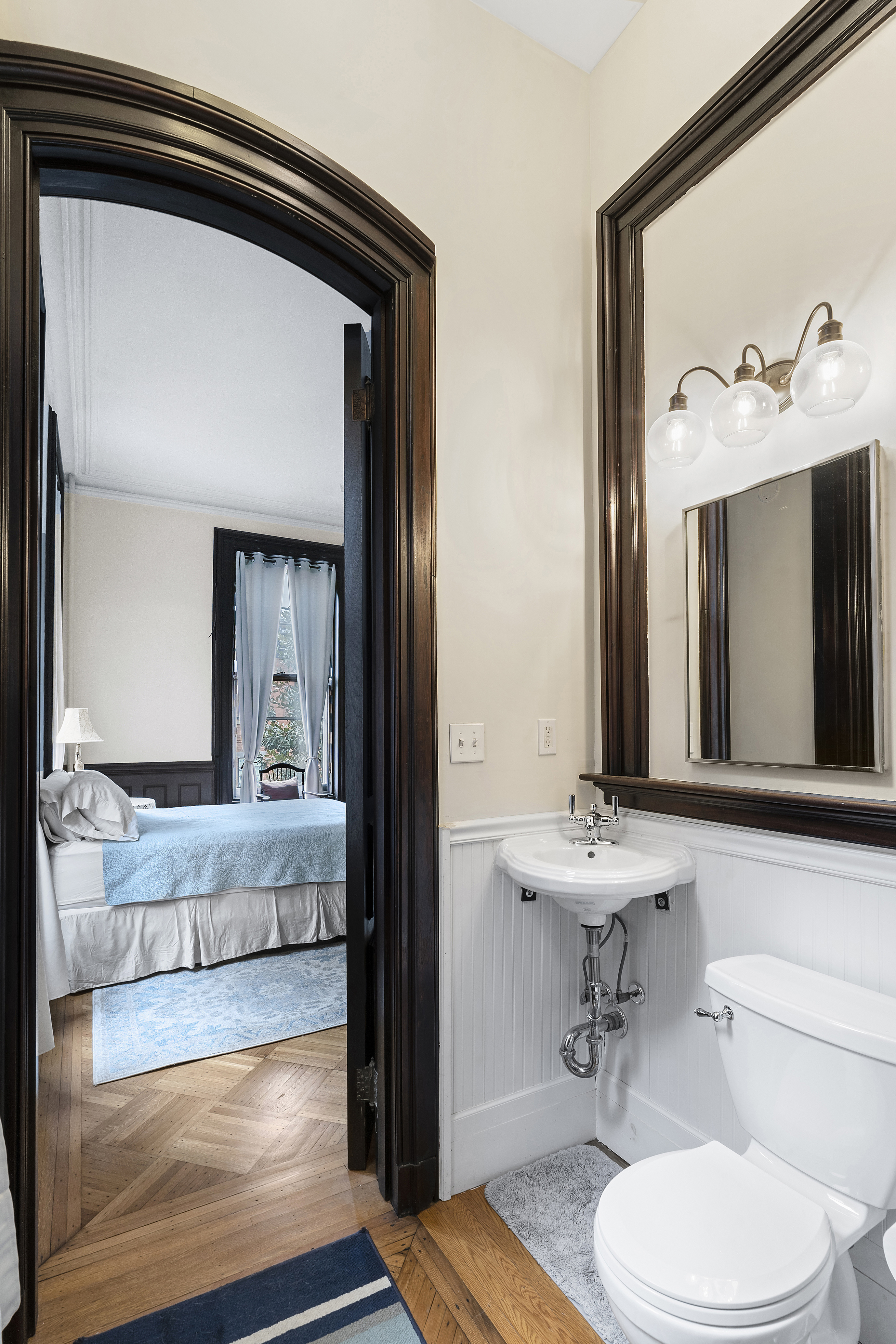 419 Clinton Avenue Brooklyn, NY 11238 - Photo 4 of 19 a bathroom with a sink and a mirror