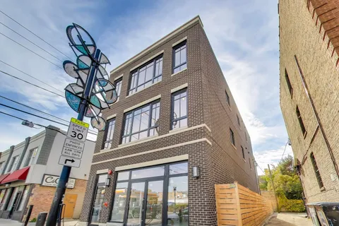 a view of a multi story residential apartment building