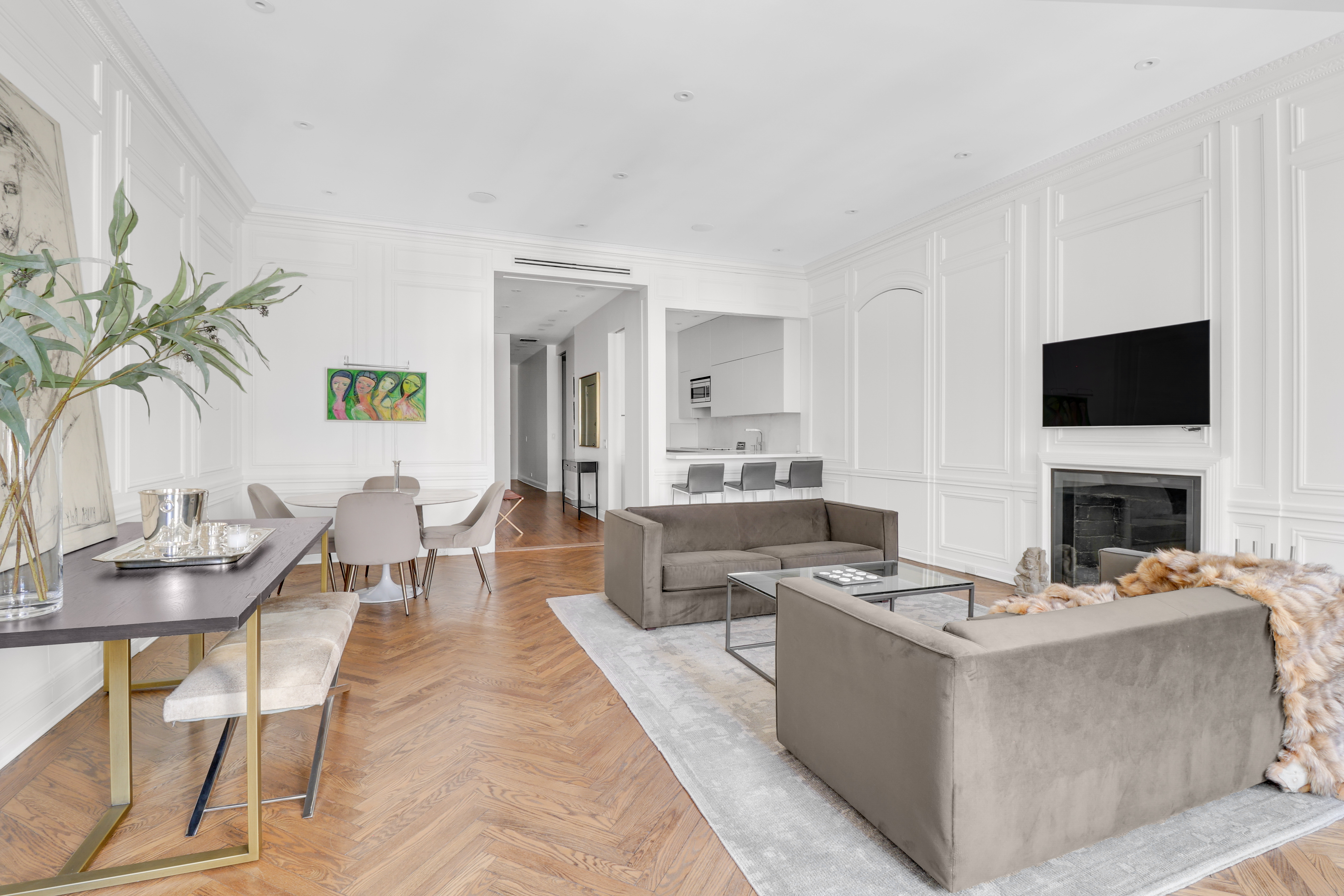 14 East 68th Street, Unit 3 Manhattan, NY 10065 - Photo 4 of 16 a living room with fireplace furniture and a flat screen tv