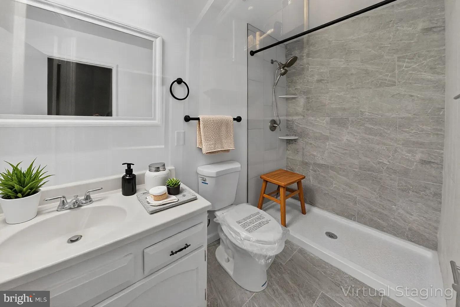 14603 Edelmar Drive, Unit 132A Silver Spring, MD 20906 - Photo 12 of 52 a bathroom with a sink a toilet and shower