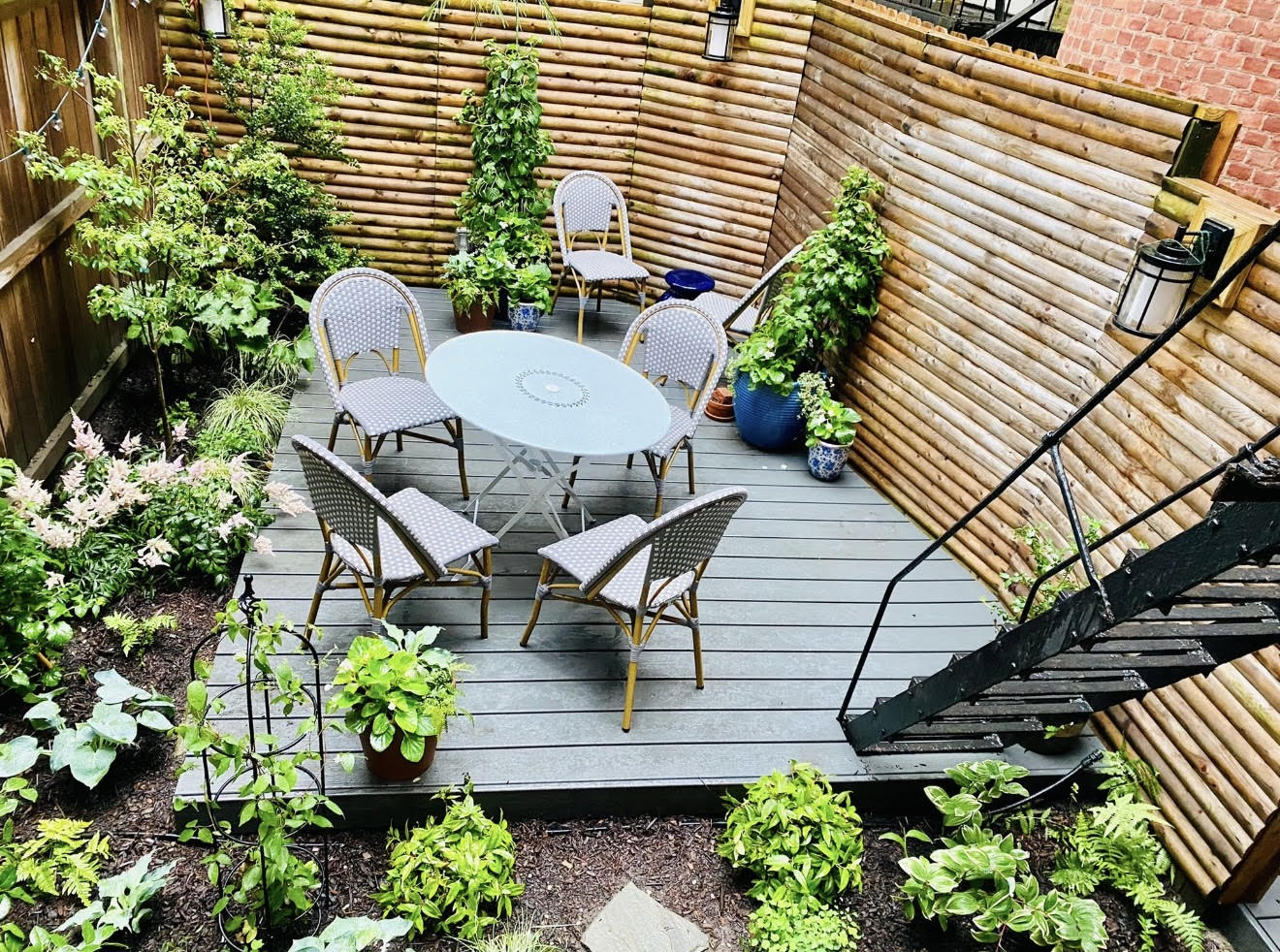 94 Joralemon Street, Unit 2 Brooklyn, NY 11201 - Photo 12 of 15 a backyard of a house with table and chairs