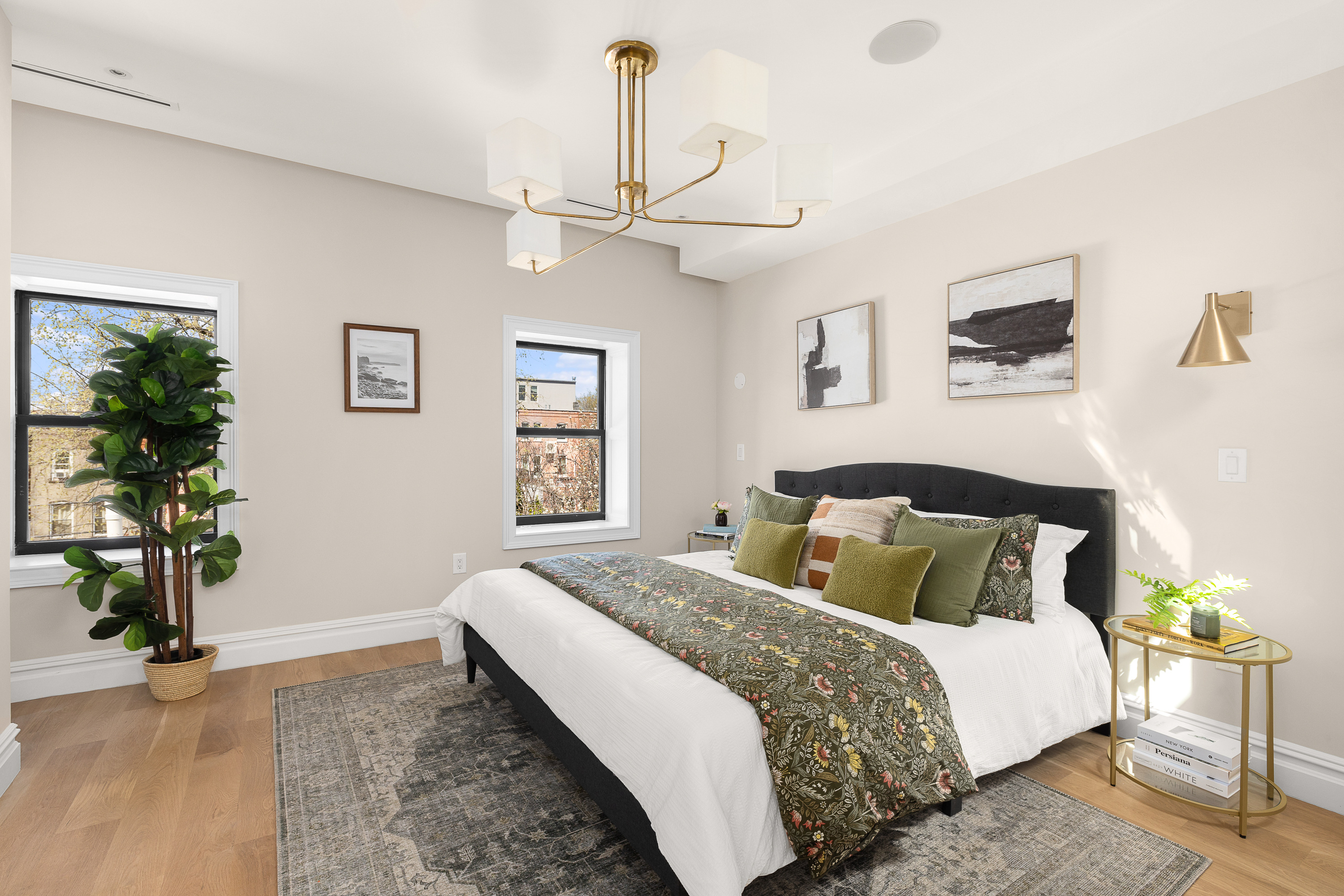 809 Lincoln Place Brooklyn, NY 11216 - Photo 9 of 20 a bedroom with a large bed and a chandelier