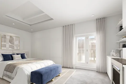 a spacious bedroom with a bed and a window