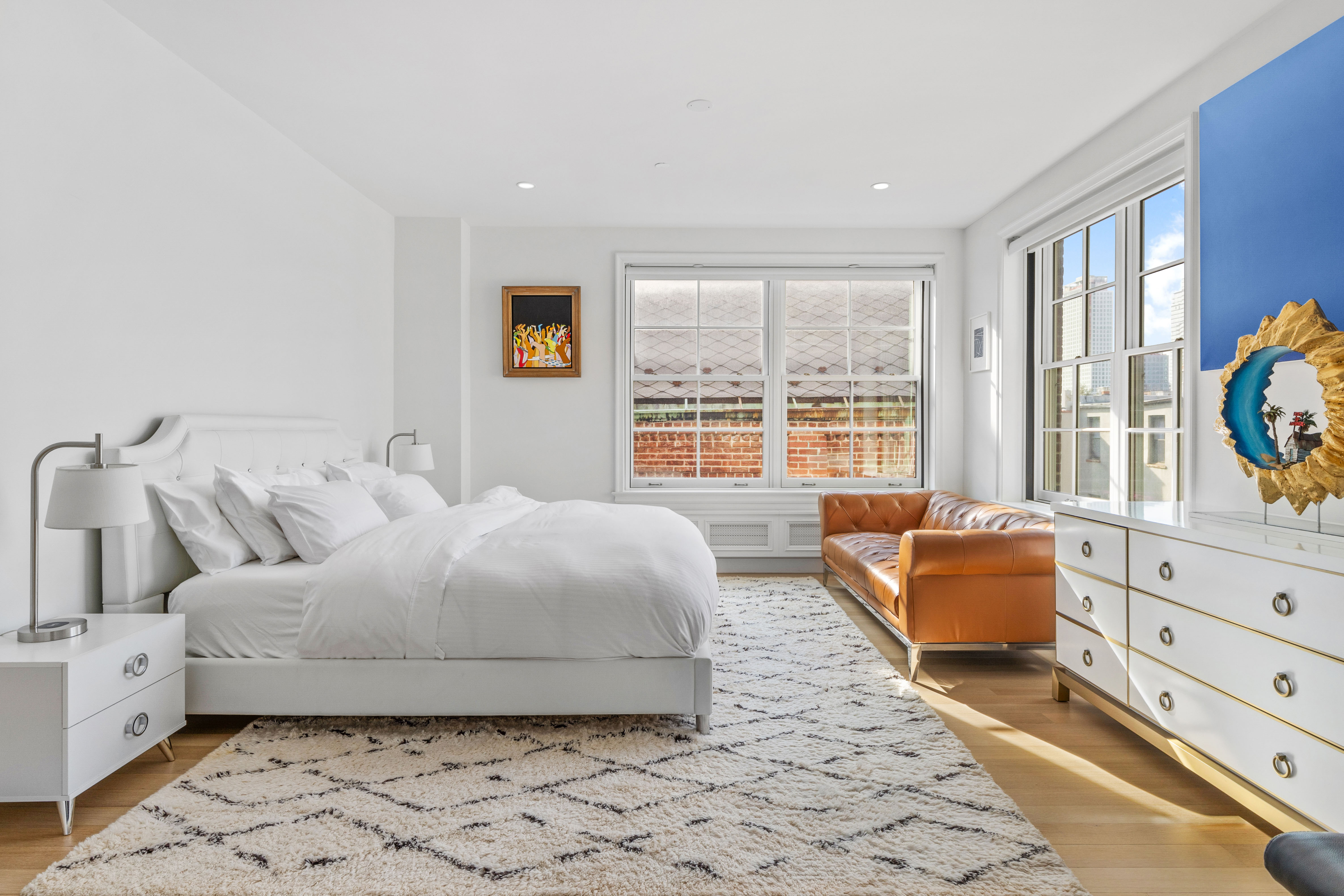 155 Noble Street, Unit 3 Brooklyn, NY 11222 - Photo 8 of 23 a bedroom with a bed and glass window