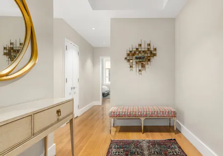 a bathroom with a sink a mirror and a shower