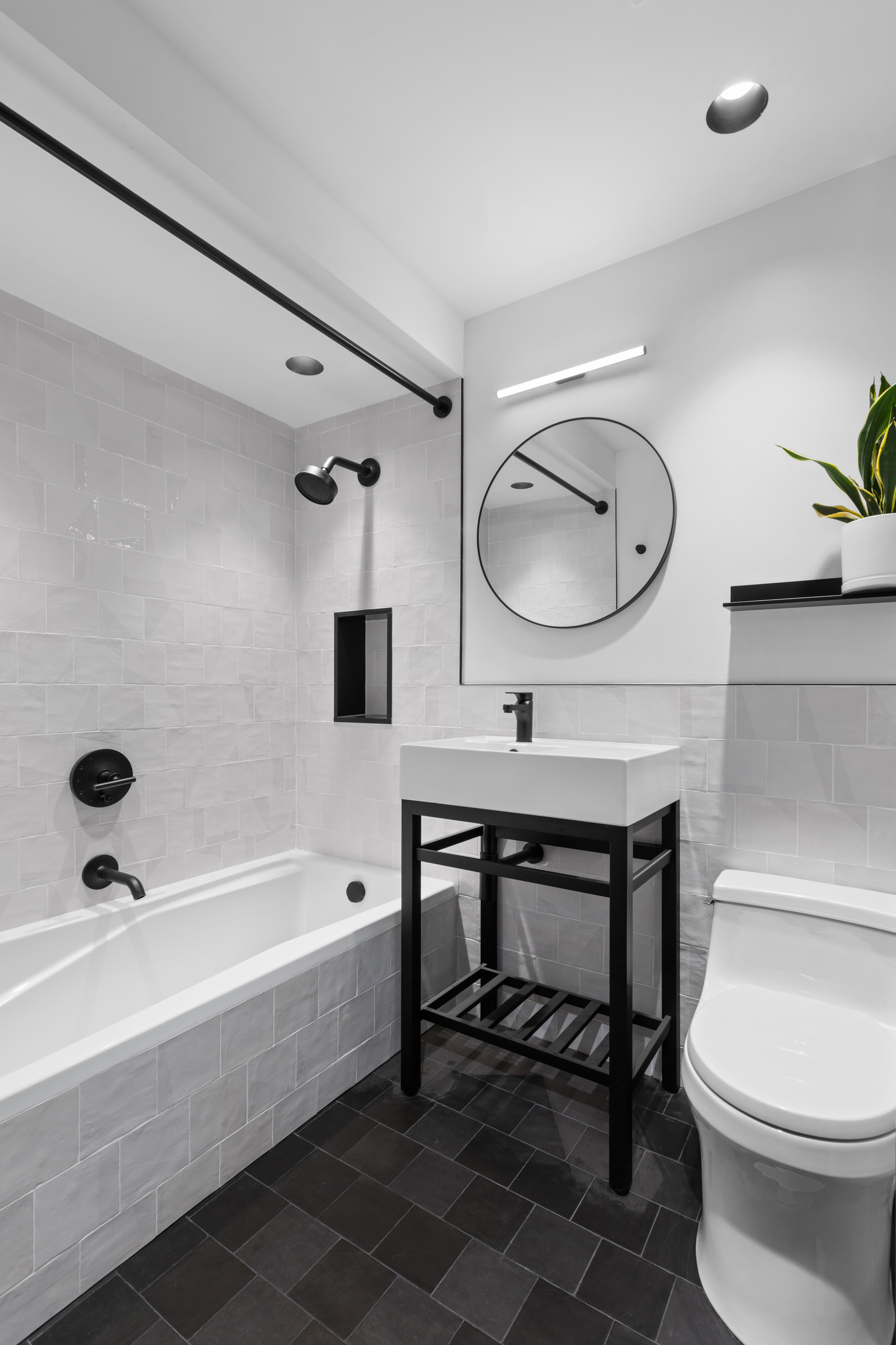 39 North Moore Street, Unit 2A Manhattan, NY 10013 - Photo 11 of 17 a bathroom with a sink a toilet and a bathtub