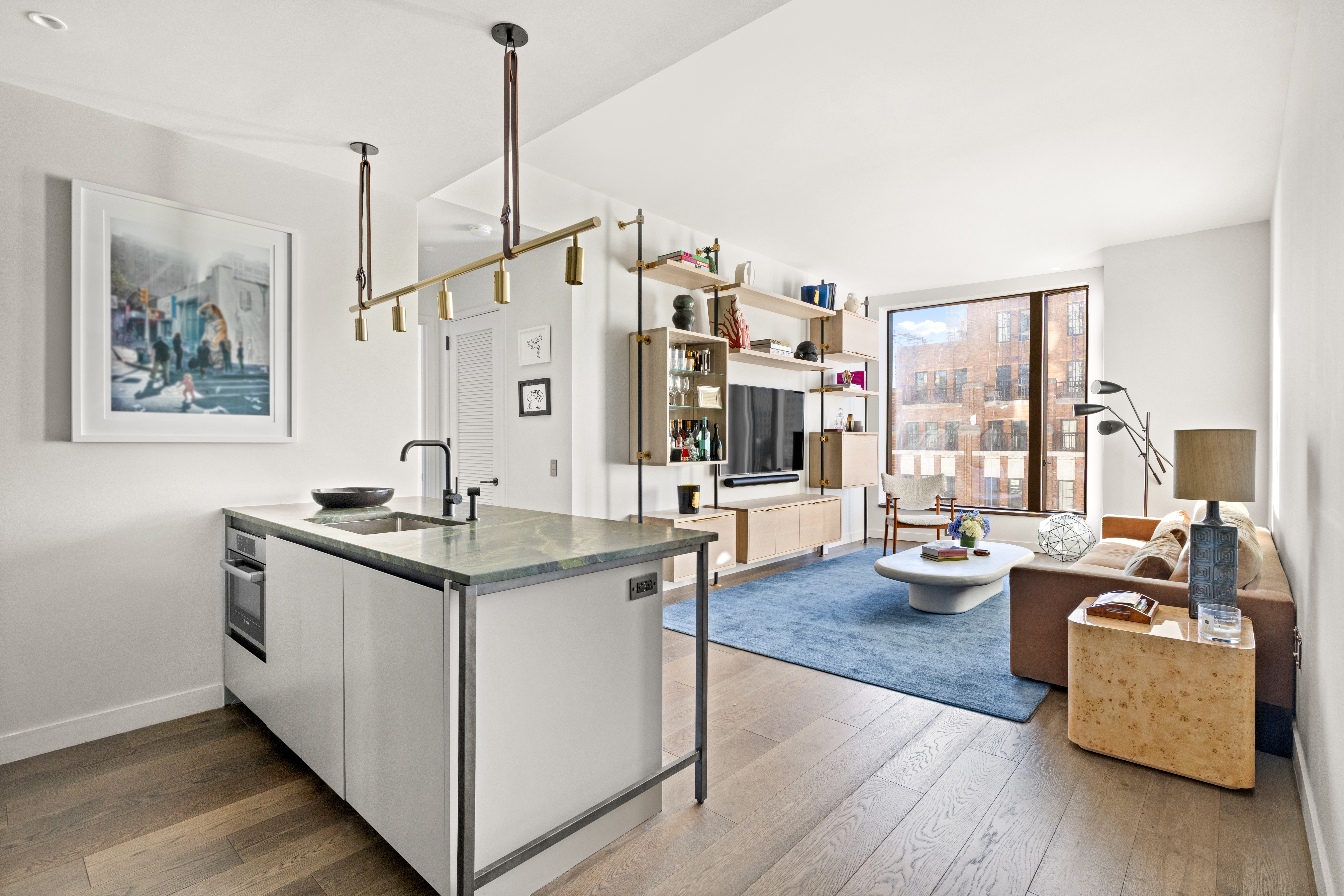 a view of living room with furniture and floor to ceiling window