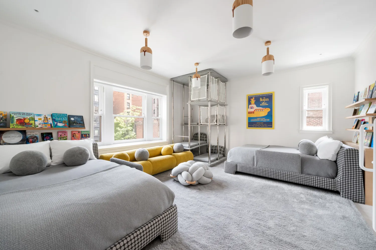 a bedroom with furniture and a large window