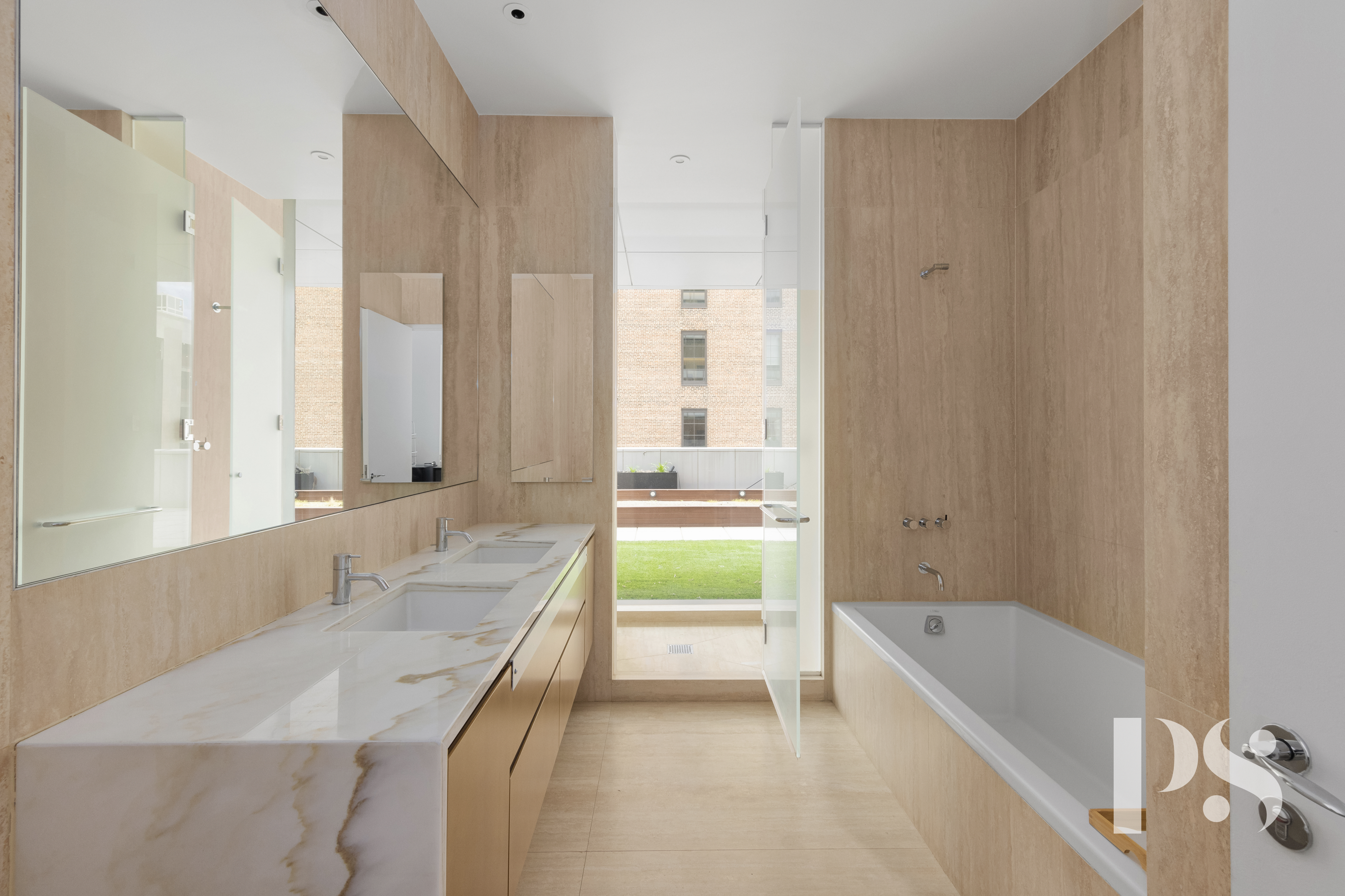 23 East 22nd Street, Unit 8A Manhattan, NY 10010 - Photo 11 of 25 a bathroom with a granite countertop tub sink and mirror